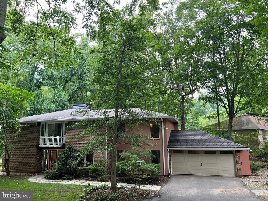 This charming house is sitting in a wooded and secluded Bradley Park neighborhood at the end of a cul-de-sac, with a wooded stream behind.  This is a spacious house with 4 Bedrooms, 3.5 Bathrooms and 3400+ SF of living space. Major home additions and renovations were done in 2006.  The ground floor office/den/library could easily be converted to a fifth bedroom. The contemporary design includes cathedral ceilings, a large central skylight and lots of recently upgraded double-glazed windows.  A gourmet kitchen with sit-at peninsula, solid wood cabinets, SS appliances, Subzero refrigerator, six-burner gas Wolf Stove, Wolf double oven plus warming oven (electric), two dishwashers and microwave.  Large master bedroom with two walk-in closets, ante-chamber suitable for office or babies sleeping area. Master bathroom with Jacuzzi and compartmented toilet. Hardwood floors throughout, two decks & two patios, a large family/great room, with a breakfast nook.  Kitchen and family room. master bedroom/bathroom suite and upgraded bathrooms part of new addition in 2006. Additional offerings include 2-car garage, custom lighting and window treatments, fireplace, lawn sprinklers and a storage shed. An ideal location, Whitman High School, Pyle Elementary, close to downtown Bethesda, Capital Crescent Trail, C&O Canal, shopping and restaurants. and near major commuter routes to DC, VA !!!