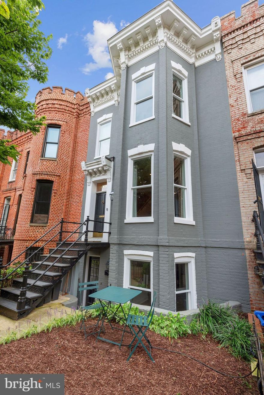 Perfectly situated in the heart of the ultra-hip 14th Street corridor, this historic row home was gut-renovated in 2018 to include touches of modern living mixed with original details including preserved brick walls and windows. This incredibly thoughtful renovation was conceived by Smith Studio and built by BlueStar Design Build. The renovation included full house extension plus a brand-new 3rd floor affording skyline views from a rooftop deck. Featuring 4 Bedrooms upstairs plus a separate 1 Bedroom rental apartment below and a deep garden with 2 car off-street parking. Highlights include sealed white oak floors, Wolf range, Restoration Hardware lighting, Waterworks fixtures, Phillip Jeffries wall covering, Carrara marble, Nest security, rebuilt chimney and fireplace with custom millwork mantle, landscape lighting and irrigation and the list goes on. Nothing was overlooked in this top-to-bottom renovation.