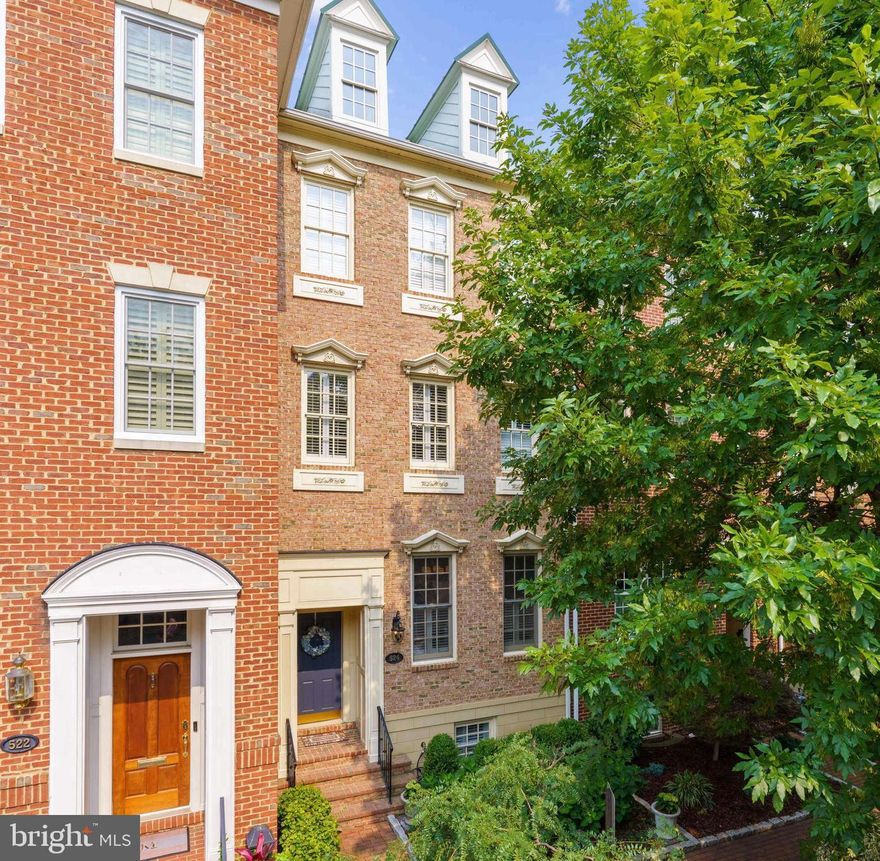 Exquisitely updated 4 bedroom, 4.5 bath, four-level townhome in Old Town Alexandria with rare 2-car garage parking. Every detail has been meticulously cared for and thoughtfully finished. This remarkable townhome does not force you to compromise on features and includes: a completely open first level totally renovated from top to bottom, a first floor half bath, a two car garage with built in Tesla Charger, a fully finished basement with plenty of room for entertaining, a home gym, or an expansive home theater, extensive storage throughout as well as two additional attics means you'll never run out of room! Dual dishwashers in the expansive kitchen island make entertaining even large groups of guests a breeze and french doors out to the professionally landscaped patio mean the party can flow indoors and out. For outdoor entertaining, this home features a private backyard patio with a retractable awning to take a break from the sun on hot summer days while still enjoying the outdoors, a gas grill including a dedicated gas line, so you'll won't need to lug heavy propane tanks back and forth, and a fountain to bring a sense of tranquility in the heart of Old Town. The second level features a spacious primary suite with tray ceiling and two walk-in closets as well as a separate home office filled with natural light. The third level features two additional bedrooms with private en-suite bathrooms and walk-in closets and an additional office area or den space. In addition to the recreation room, the lower level also includes a bedroom with walk in closet and a full bath. This home is just one block from Trader Joe's, two blocks from Harris Teeter, and just a short walk from King Street and dozens of dining options.