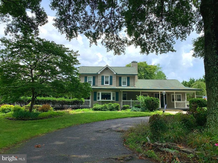 This rare treasure, Breezy Farm (established in 1998) is now available, desirably located close to BWI, Ft. Meade, DC, Annapolis, and Baltimore! If you are a car enthusiast (AKA Motorhead) this might be your perfect place! There's too much to describe, on almost 5 acres, so you'll have to see it for yourself! There are 6 bedrooms total, and 4 1/2 baths total between 2 properties! The main 3 bedroom, 2 1/2 bath home is full of character, and will bring you many years of memories. Beautiful hardwood floors, as well as lots of ceramic tile flow throughout for easy maintenance. And even heated floors in the bathroom & kitchen! The kitchen was opened up and remodeled with granite, and newer stainless appliances. Follow around to the huge family room and spacious sunroom. The Primary Suite on the main level has a sitting area, walk-in closet with built-ins, and attached laundry for your convenience. Ceiling fans in almost every room help keep you cool.  Step outside to enjoy the breeze on your two front porches. There's a bonus 20 X 40 ft.  saltwater inground pool enclosed with vinyl/aluminum fencing complete with safety gates. Step in and refresh yourselves on the two soaking benches. Consider the quality of the Amish built, screened in gazebo and pool house, also with ceiling fans. NO HOA so bring your swimsuit, boat, RV, bikes and other toys and enjoy your home and acres of private land. There are two detached 36 X 40 garages for all of your work tools, fun stuff, auto repairs, cabinetry? A 2 bay & a 4 bay!!! One even has heat and A/C & bathroom to keep you comfortable all year round.  An air compressor is included!  And even a lift!! The doors are 8ft. and the ceilings are 10ft! This is perfect for all of you car enthusiasts! Another bonus is the legally permitted mobile home. This beauty has 3 bedrooms and 2 baths. New floors & all appliances! 36 zoned irrigation system. Imagine the possibilities here! Maybe you could design your own farm? Bring your horses and chickens? Work from home! Fix your cars? Create lasting memories!