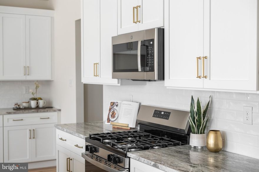 New Construction without the wait! This NEW HOME is nearing completion in Kennett Square’s newest luxury townhome community—Copperleaf Ridge! Nestled in a peaceful natural setting with abundant green space, the thoughtfully designed community is just minutes from the charm and culture of historic Kennett Square.  Welcome yourself home to the Sutton plan by Rouse Chamberlin Homes—a beautifully designed and builder upgraded 2-story, 3-bedroom, 2.5-bath townhome with approximately 1,902 square feet of modern living space.  Enjoy included luxury finishes like 9-foot ceilings and beautiful laminate plank flooring on the first floor, a chef-inspired Kitchen with Century white cabinetry, exquisite Venezia quartz countertops, 4x4 ceramic tile designer backsplash, and a large central island—perfect for everyday meals or entertaining.   A triple window in the Great Room brings in natural light, while the Dining area includes a sliding glass door leading to a low-maintenance rear deck with steps to grade. Upstairs, the spacious primary suite offers a walk-in closet and upgraded ceramic tile bath with elegant dual quartz vanities and brushed nickel Moen fixtures. Two generously sized secondary bedrooms, a full hall bath, and a convenient second-floor laundry complete the home.   Additional features include a Hettinger brushed nickel lighting package, recessed lighting, ceiling fan mounts, and a 2-car garage with door opener. The full basement includes a plumbing rough-in for a future bathroom, offering excellent potential for added living space or a guest suite. At Copperleaf Ridge, enjoy a low-maintenance lifestyle with snow removal and landscaping included.  The community’s prime location offers easy access to Wilmington and Philadelphia and is just minutes from Longwood Gardens and downtown Kennett Square, where fine dining, art venues, and annual festivals create a vibrant quality of life. Photos show the off-site decorated Sutton Grand model while this home is under construction.  A full list of included options is available.  Contact Copperleaf Ridge today!