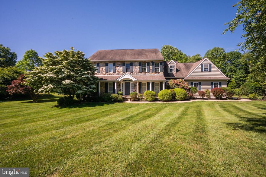 Welcome to 101 Stonegate Drive in the prestigious and bucolic community of Stonegate.  Sitting on a private 1.05 acre property, you will fall in love with the setting, the modern updates, and the warm custom design throughout.  This elegant and expansive home features an open main living space, gorgeous kitchen, main floor office/den, an entertainer’s dream basement, and an idyllic outdoor living & entertaining space.  Step inside this home to beautiful hardwood floors and the two-story foyer with turned staircase.  The formal living & dining rooms are on either side, each with lovely crown molding and natural light.  Flow into the grand main living space joining the kitchen, dining area, and family room, with a soothing view outside from each space.  This kitchen leaves nothing to be desired with recessed lighting, granite countertops and tile backsplash, abundant cabinetry including dedicated desk area, and large center island with seating.  The adjoining dining area is perfect for casual meals and opens beautifully to the expansive deck and spectacular outdoor space.   Enjoy grilling, dining, relaxing, and entertaining on the oversized deck with built-in awning overlooking the inground pool and nature all around.  This private and peaceful space is the perfect setting for making memories with family and friends for years to come… just in time for Spring and Summer! Back inside, the spacious family room offers plenty of space to gather and relax with a floor-to-ceiling stone fireplace in the center of it all.  On this level, you will also find a dedicated professional office/den, the ideal mud/laundry room with laundry sink and storage, and a powder room with granite vanity. Upstairs you will find all 4 bedrooms, including the spacious primary suite with tray ceiling and recessed lighting, large walk-in closet, and en-suite bath with glass shower, soaking tub, and double vanity.  Three additional bedrooms and 1 full bath with double vanity complete the second level. The lower level of this home is finished beautifully with recessed lighting, custom built-ins, and granite wet bar.  Watching sports, holiday gatherings, and entertaining with friends just reached the next level.  In addition, this level hosts a full bath and another bonus room which could easily be a 5th bedroom, second office, gym, or whatever your needs require. Also here, plenty of storage! Valuable bonus features include a water softener, oversized garage with epoxy flooring, cabinetry, and house generator connection, and the perfect outdoor shed/pool house to store outdoor furniture, equipment, and pool supplies.  Situated on a private & tranquil cul-de-sac within the Avon Grove School District and located close to everything this area has to offer.  This home has everything!  Pool in AS-IS condition.  Be sure to view the floorplans, virtual tour, and schedule a showing today.