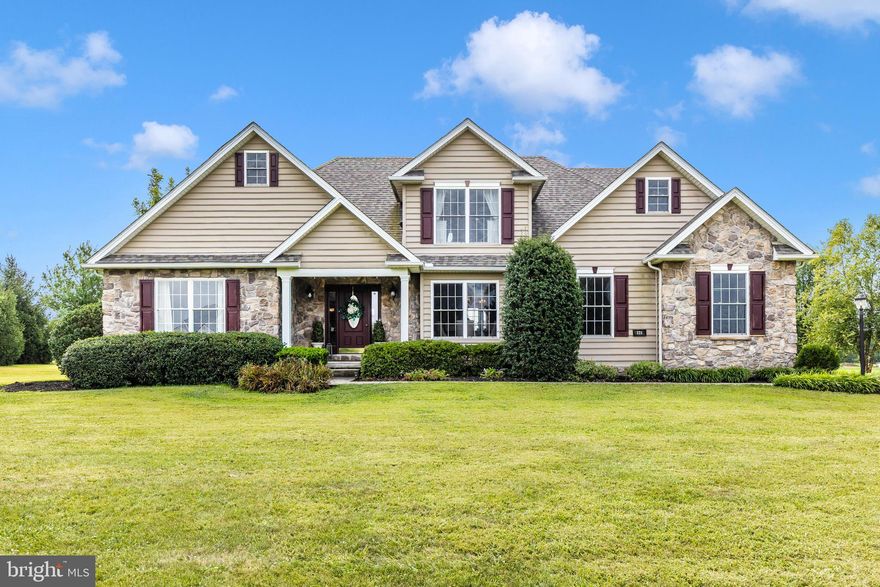 Welcome to your new home...

Set on nearly 3 acres of picturesque countryside, this 4-bedroom, 2.5-bath colonial offers the perfect mix of charm, comfort, and thoughtful updates. Located just minutes from downtown Littlestown, Rt 97, and the Maryland line, you’ll enjoy peaceful country living with everyday conveniences close by.

Inside, sunlight fills the formal living and dining rooms, while the open-concept family room features soaring two-story ceilings, a cozy gas fireplace, and sweeping backyard views. The spacious eat-in kitchen boasts a two-tiered island, new backsplash, updated hardware, and several new stainless steel appliances—including a refrigerator, microwave, and dishwasher.  A main-level laundry room and remodeled half bath are conveniently located off the kitchen, with direct access to the expansive rear deck. The private primary suite features a spa-like bath with a jetted tub, separate shower, and dual vanity; also located on main level. Upstairs, three additional bedrooms, a full bath with double sinks, and a versatile loft space—perfect for a home office or play area—complete the upper level.

This home has been meticulously maintained and upgraded, including a brand-new premium roof, new water heater, new carpet throughout, new gutters, and a Level 2 EV charging outlet in the garage. You’ll also appreciate the custom-built-in bookshelf, new well pump, new sump pump, and other quality improvements.

You’ll love the attached 2-car garage plus a detached 1-car garage—ideal for extra vehicles, storage, or a workshop. The enormous unfinished basement offers limitless potential for future living space.
Additional highlights include a 1,000-gallon owned propane tank fueling the fireplace and furnace (with lines already in place for a gas stove), and a recently serviced septic system (2023).

With stunning views, major recent upgrades, and a location that balances tranquility with convenience, this is truly a move-in-ready countryside retreat.