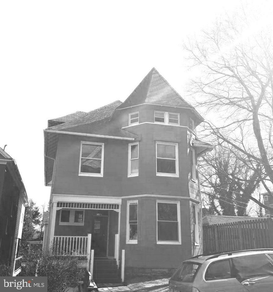 Stately house in desirable neighborhood features 4 levels including basement. Large rooms, high ceilings and plenty of charming hardwood floors and trim.  
This home has much potential.  Needs rehab.  Power and water have been updated and restored.