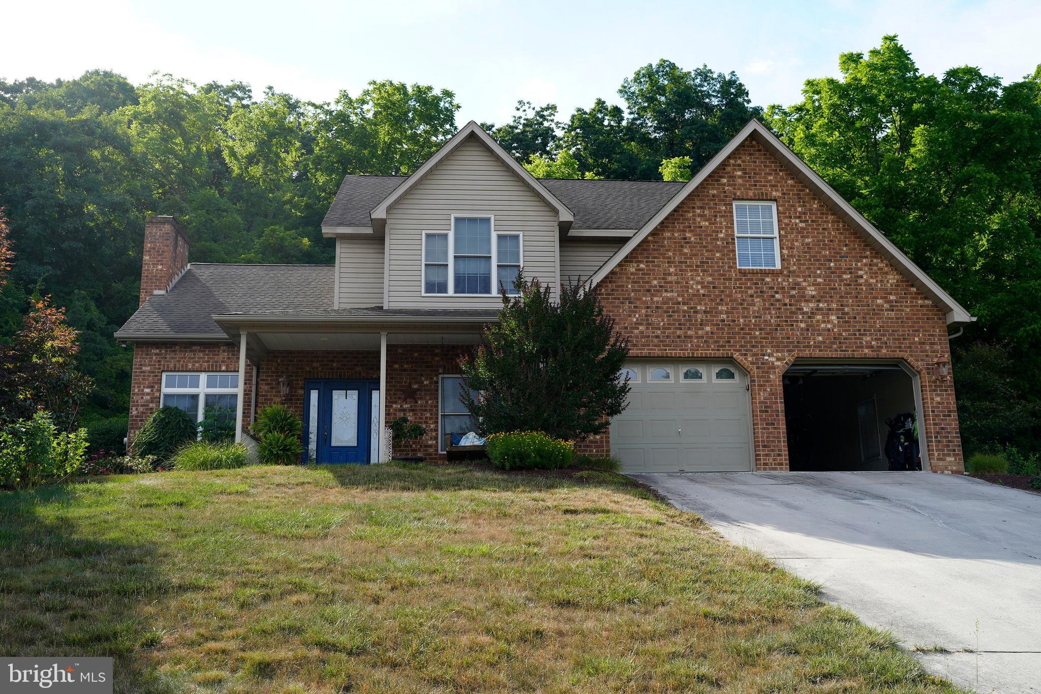 Beautiful four bedroom home located just outside Cumberland City limits designed with year round living and relaxation in mind. The private multi-level deck is perfect for family barbeque or quiet summer evenings. The contemporary fireplace is waiting for cozy winter evenings. Holiday gatherings? The finished basement area is the perfect place. The spacious master suite provides a quiet haven to wind down and recharge. Two car attached garage is already equipped with a charger for your car. Conveniently located near UPMC-WMD, Allegany College, I-68 and downtown. The Cumberland Country Club is minutes away. The updated kitchen has a beautiful work island stainless appliances. The full poured concrete basement has a family room, full bath and ample storage areas. The rear driveway provides easy access to the rear yard area.rage