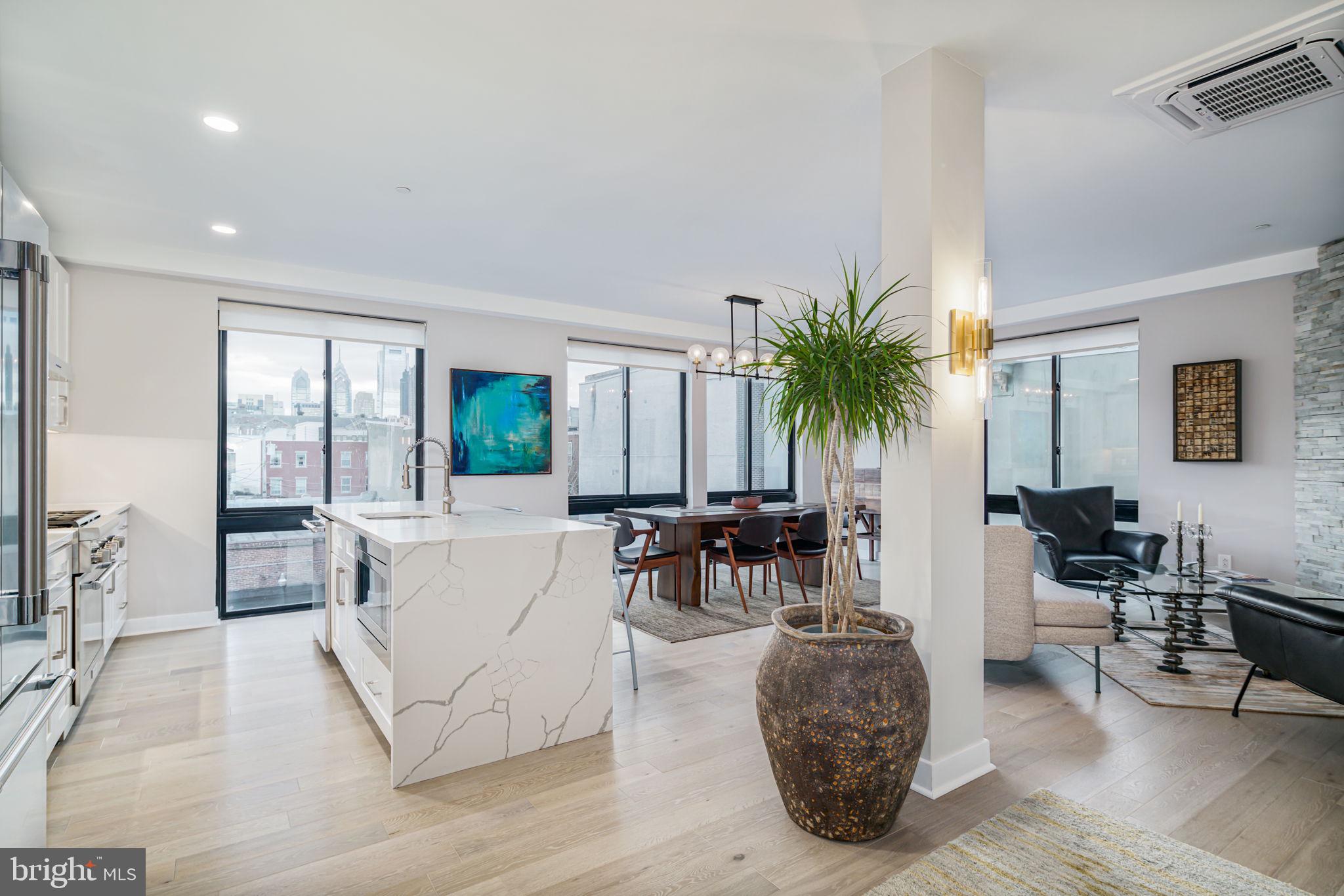 Are you looking for Luxury in Philadelphia? Enjoy the comforts of an entire floor to yourself, private elevator entrance, roof deck, tax abatement, and fireplace! Welcome to 716 N 15th St, #301, a breathtaking new construction corner condo located in Francisville/Fairmount neighborhood with upgrades galore. If you are looking for a one-of-a-kind, magical home on a great block, look no further! What makes this home so special? Affordable condo fees, a whole floor to yourself, an elevator direct into your private residence, approximately 9.5 years remaining on the real estate tax abatement, and much more! Located just steps from the Fairmount Subway station on the Broad Street line and blocks away from some of the best restaurants and shops in the city, this spacious 1500 sq ft, 2 bedroom, 2 bath condo features a modern and open floor plan with huge windows on multiple sides, tons of natural light, and is overloaded with modern amenities throughout. When you enter the front door of the building, you will be greeted by a spacious and well-maintained community vestibule and mail room. From there, you will take the elevator up into your private residence, located on its own floor of the building—talk about luxury! The elevator opens right into your new home! Upon exiting the elevator, you will find a sitting area leading to an open living room with huge windows, a gas fireplace, with accent wall with stone tile, and a spacious dining room. In addition, the open chef’s kitchen features upgraded stainless steel Thermador appliances, a vent hood, quartz countertops with waterfall edges, designer lighting fixtures, and so much more. The guest bedroom is large enough for a king bed and features a spacious closet with a built-in custom shelving system. A full hall bathroom is also located on this floor, with designer spa tile and a custom vanity. Down the hall, you will also find the spacious master suite with a walk-in master closet and your private en-suite master bathroom, professionally designed with a spa-like shower with dual shower heads and a waterfall shower head, along with a custom glass shower door and a double floating sink and vanity. Take the elevator from your front door up to the roof, and you will find a massive community roof deck with a built-in polished concrete bar and TV, a shared grilling station, and amazing skyline views of the city. Imagine sipping your morning coffee or an evening cocktail while lounging on a beautiful summer night with your loved ones and taking in 365-degree views of the city. Other amenities include minimal stairs to get into the unit, recessed lighting throughout, a fob and intercom system, custom solar shades, a state-of-the-art energy-efficient heating and cooling system, a gas fireplace, bike storage and a basement storage locker, Miele front-loading washers and dryers, and many more. Don’t forget, you can walk to Fairmont and Center City in just a couple minutes, along with many bars, restaurants, parks, museums, and shops. Take a look at the virtual tour!