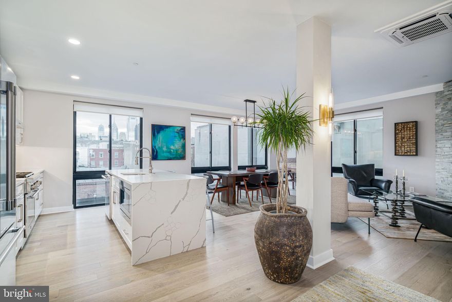 Are you looking for Luxury in Philadelphia? Enjoy the comforts of an entire floor to yourself, private elevator entrance, roof deck, tax abatement, and fireplace! Welcome to 716 N 15th St, #301, a breathtaking new construction corner condo located in Francisville/Fairmount neighborhood with upgrades galore. If you are looking for a one-of-a-kind, magical home on a great block, look no further! What makes this home so special? Affordable condo fees, a whole floor to yourself, an elevator direct into your private residence, approximately 9.5 years remaining on the real estate tax abatement, and much more! Located just steps from the Fairmount Subway station on the Broad Street line and blocks away from some of the best restaurants and shops in the city, this spacious 1500 sq ft, 2 bedroom, 2 bath condo features a modern and open floor plan with huge windows on multiple sides, tons of natural light, and is overloaded with modern amenities throughout. When you enter the front door of the building, you will be greeted by a spacious and well-maintained community vestibule and mail room. From there, you will take the elevator up into your private residence, located on its own floor of the building—talk about luxury! The elevator opens right into your new home! Upon exiting the elevator, you will find a sitting area leading to an open living room with huge windows,  a gas fireplace, with accent wall with stone tile, and a spacious dining room. In addition, the open chef’s kitchen features upgraded stainless steel Thermador appliances, a vent hood, quartz countertops with waterfall edges, designer lighting fixtures, and so much more. The guest bedroom is large enough for a king bed and features a spacious closet with a built-in custom shelving system. A full hall bathroom is also located on this floor, with designer spa tile and a custom vanity. Down the hall, you will also find the spacious master suite with a walk-in master closet and your private en-suite master bathroom, professionally designed with a spa-like shower with dual shower heads and a waterfall shower head, along with a custom glass shower door and a double floating sink and vanity. Take the elevator from your front door up to the roof, and you will find a massive community roof deck with a built-in polished concrete bar and TV, a shared grilling station, and amazing skyline views of the city. Imagine sipping your morning coffee or an evening cocktail while lounging on a beautiful summer night with your loved ones and taking in 365-degree views of the city. Other amenities include minimal stairs to get into the unit, recessed lighting throughout, a fob and intercom system, custom solar shades, a state-of-the-art energy-efficient heating and cooling system, a gas fireplace, bike storage and a basement storage locker, Miele front-loading washers and dryers, and many more. Don’t forget, you can walk to Fairmont and Center City in just a couple minutes, along with many bars, restaurants, parks, museums, and shops. Take a look at the virtual tour!