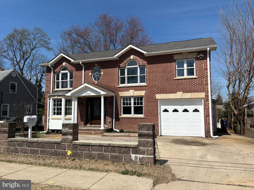 Open House Saturday 4/11 12-2PM. This exceptional expanded full brick exterior home is truly a standout in the neighborhood, offering an unbeatable location just a short walk to the Metro while delivering the comfort and feel of a newer home. Featuring 4 bedrooms and 4 full baths, this beautifully maintained brick residence combines thoughtful updates with versatile living spaces. The main level showcases an ideal open floor plan designed for today’s lifestyle, providing flexibility for both everyday living and entertaining. The updated kitchen is a highlight, featuring crisp white cabinetry, quartz countertops, a stylish tile backsplash, and stainless-steel appliances, including a gas range. Recently resurfaced hardwood floors add warmth and elegance throughout the main and upper levels. A spacious main-level bedroom and full bath offer a convenient option for guests, multigenerational living, or a private home office. Upstairs, you’ll find three generously sized bedrooms, including a luxurious owner’s suite complete with a spa-inspired bath featuring a soaking tub, separate shower, and refined finishes. A well-appointed hall bath serves the additional bedrooms. The fully finished lower level expands your living space with a large recreation area, an additional room ideal as a fifth guest bedroom, office, or hobby space, another full bath, and a dedicated laundry room. Step outside to your own backyard retreat, complete with a paver patio and a spacious grassy area—perfect for relaxing or entertaining.  Car enthusiasts and business owners alike or just the average owner looking for more garage space will appreciate the rare back-to-back two-car garage configuration, offering exceptional parking and storage options. Recent updates include a new water heater (2026) and HVAC system (2024), with the roof and windows previously replaced by a prior owner. All of this is conveniently located near shopping, dining, schools, and Metro access—making this home the perfect blend of comfort, style, and convenience.