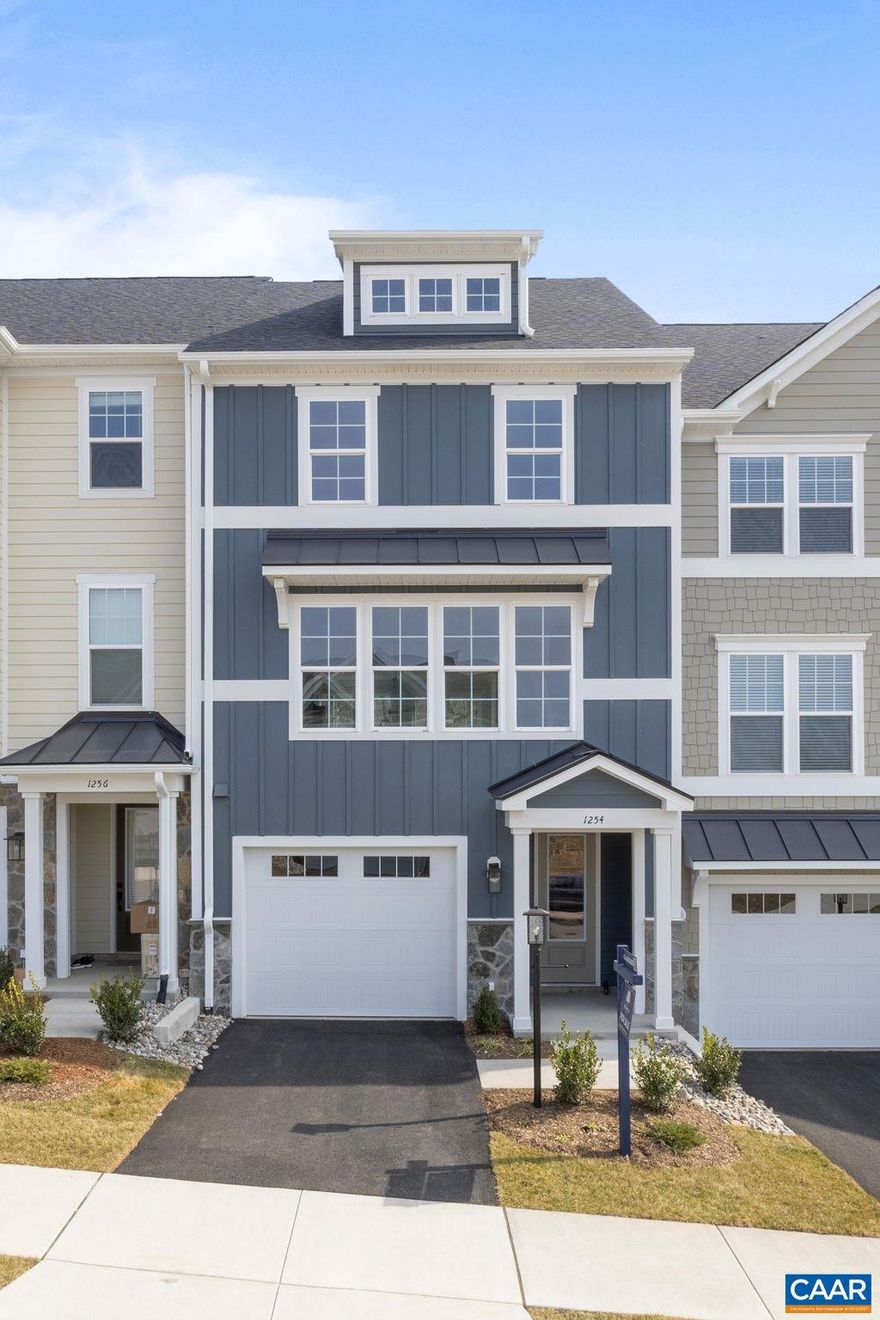 Newly completed new construction! Enjoy gorgeous VIEWS from your 4th Level COVERED ROOFTOP TERRACE. Welcome to the Grove at Brookhill, a quiet NEW neighborhood nestled in the woods with all the conveniences of Route 29 North in Charlottesville. The Holly townhome is an effortlessly open plan with a spacious galley kitchen and INCLUDED maintenance-free DECK - perfect for an evening of entertaining friends and family. The ATTACHED 1-CAR GARAGE provides easy parking/storage.  Use 4th FLOOR LOFT/BONUS ROOM as an alternative home office, hobby, or exercise room. 1ST FLOOR BEDROOM AND FULL BATH.  The Grove at Brookhill will offer parks, walking trails, mountain views, shopping, dining, tennis courts, gyms, and more. Schedule your tour today! ACTUAL PHOTOS.,Painted Cabinets,Quartz Counter,White Cabinets