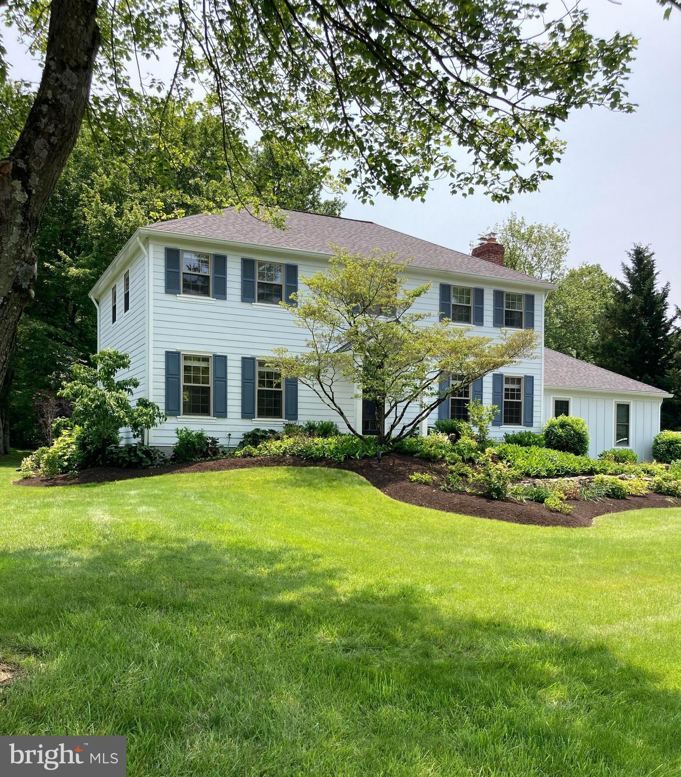 This classic two-story colonial home sits on a beautiful .74-acre property, in the tranquil Canterbury Woods neighborhood in Berwyn, PA. This home has a wonderful layout for entertaining and for family living, along with the yard to compliment.
Situated in the top-ranked, award-winning Tredyffrin-Easttown School District, this home offers quality living at its best. The exterior of this house has been completely renovated, including new Hardie-Board siding and trim, Pella windows, a new roof, plus a 16’ x 24’ TimberTech deck. The front and back yards have been exquisitely planned and cared for. Upon arriving, saunter on the flagstone walkway up to the classic portico and front-door. Once inside, enjoy the welcoming center-hall, flanked by a spacious living room to the left and a cozy family room with a fireplace to the right. The formal dining room has large bay-windows and offers elegance, accented by a chair rail. The large kitchen includes an eat-in area, and presents views of the new deck and private backyard. Adjacent to the kitchen, there is also a recently renovated
powder room. The second level features a primary bedroom suite, including a full bathroom, generous closet space, and a vanity. Three additional bedrooms share a hall bathroom. The home boasts many updated mechanical systems, including a new HVAC system, a new hot-water heater, and a new oil tank, as well as a new Generac generator. Laundry, mechanical systems, and additional storage are in the basement. The attached 2-car garage is very large. Also of note, the kitchen and 2 upstairs bathrooms are ready for new owners to update with their own personal touches. This house also offers several possibilities for additions or further remodeling.