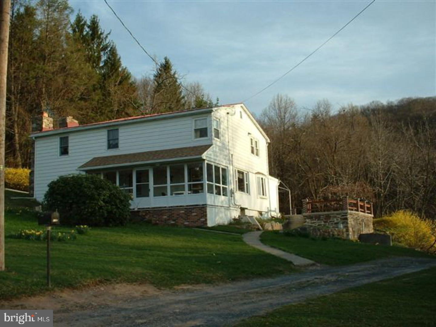 Here it is! Country living at its finest. Well kept home, on top of the mountain, 5 acres of yard and woods, 20x45 htd in-ground pool and views for miles and miles. Beautiful stone fireplace in the living room. 3 season room with southern exposure and incredible views. Outbuilding for garage and storage. Laundry on main floor. Additional crock next to stone FP for wood or coal stove. Mailing Address Continued: Schuylkill Haven Color: white Amp: 200
