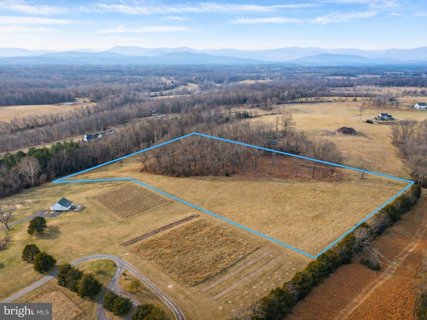 ***All Buyers must be accompanied by a licensed Real Estate Agent***

Discover the freedom and opportunity of 13.34± acres of buildable land for sale in Madison County, Virginia, ideally suited for a custom home, homestead, or long-term land investment.

Located in the scenic Larkins Mill area, this agriculturally zoned property offers a rare combination of rolling pasture, mature hardwood trees, a flowing stream, mountain views, and exceptional privacy. With generous distance between neighbors and peaceful natural surroundings, this is the kind of land that invites you to slow down, spread out, and create something lasting.

Whether you dream of building your forever home, starting a hobby farm, creating a private retreat, or securing a hard-asset investment, this property provides the space and flexibility to bring that vision to life. There is ample room for gardens, livestock, chickens, barns, workshops, trails, and outdoor recreation, making it ideal for homesteaders and those seeking a self-sufficient lifestyle.

The property is build-ready, with a recent survey and soils evaluation completed in December 2024, confirming approval for a 4-bedroom conventional septic system (Onsite Sewage System Construction Permit Letter - Dec 4, 2024 ) . Survey in Agent notes. Electric access is available via an existing easement, and a private road maintenance agreement is in place. Prior covenants and restrictions have been said to expire, offering greater freedom in how you design and use the land.

For modern connectivity, Starlink internet is a potential option, making remote work and modern living possible while enjoying rural Virginia.

Despite its private, country setting, the property is conveniently located approximately 22 minutes from downtown Culpeper, providing access to shopping, dining, medical services, and everyday amenities. Wineries  within driving distance (Prince Michel, Revalation Vineyards, Winery at Rapidan, Early Mountain Vineyards, and more)

If you are searching for Virginia acreage, farm land for sale, homestead property, or rural land with mountain views, this Madison County property delivers space, serenity, and long-term value in one remarkable offering.

Madison County land for sale, Virginia acreage, buildable land, agricultural zoning, homestead property, hobby farm, rural living, private land, mountain views, stream, rolling pasture, hardwoods, land investment, country living, off-market feel, generational land