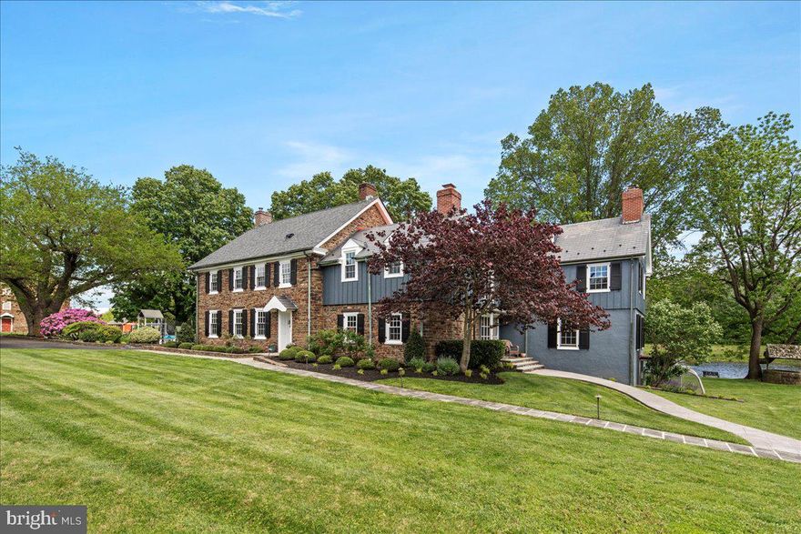 Situated on just over 23 picturesque acres in the heart of Bucks County, L&M Farms presents a unique opportunity for those with discerning tastes and diverse interests. The estate boasts an impressive 5,800 square feet, featuring five bedrooms and six bathrooms. Upon arrival, you'll be captivated by the recent handcrafted stone entry walls with elegant lighting as you enter from the road. The scenic, long driveway gracefully winds over a bridge, leading you to the exquisite property. Here, another set of beautiful fieldstone walls and elegant black iron gates ensure complete privacy and grandeur. At the top of the drive, you'll find a fully renovated four-car garage with a charming three-bedroom, two-bathroom guest house or in-law suite. To the left stands a meticulously maintained historic bank barn, over 200 years old, equipped with four stalls, electricity, and heated water, offering endless possibilities as a working barn or a stunning venue for private events. Adjacent to the bank barn is an additional three-car garage for extra storage. The beautifully updated farmhouse seamlessly blends historic charm with modern luxury. Original fieldstone accents are featured throughout, including in the newly renovated chef's kitchen. This culinary haven boasts luxurious GE Profile matte black appliances and a large, custom-crafted marble island with seating for four to five people. The open floor plan of the main living space is perfect for entertaining, enhanced by 2 picture windows overlooking the serene pond, surround sound, a trey ceiling, and recessed lighting throughout. Recent updates also include new windows, a new oil burner, a new roof, and fresh exterior and interior paint. A comprehensive list of renovations highlighting the care and appreciation invested in this lovely home by its current owners is available upon request. The property also features several versatile at-home office spaces and formal sitting areas, along with a stunning fully renovated porch with shiplap interior walls, skylights, recessed lighting, surround sound wiring, and a ceiling fan. This sun porch offers an ideal space for peaceful mornings or afternoons, overlooking the tranquil fish-filled pond and providing a true sense of quiet serenity. The recently updated master bedroom ensuite, complete with a custom walk-in closet, offers an elegant and tranquil retreat. For family enjoyment, the custom-created theater room features an LED starry ceiling, surround sound, an acoustical movie screen, and a modern multi-color changing LED light wall. Additional amenities include an in-home gym, a temperature-controlled wine cellar, and two laundry areas. Stepping out the side entry and down the sidewalk, you'll discover your own private oasis: a heated saltwater pool with freshly renovated plaster, accompanied by a completely updated pool house, promising unforgettable summer weekends. This exceptional property truly caters to a variety of lifestyles. Car enthusiasts will appreciate the seven garages, four of which are heated. Equestrians will have full access to the entire property, including professional man-made walking/ riding trails within the four-acre wooded area. Those with a passion for ATVs or dirt bikes, the fishermen or simply anyone who appreciates a remarkable piece of Bucks County history, will find something to cherish here.
This estate is a must-see, offering a rare blend of luxury, history, and privacy. L&M Farms delivers timeless grace, style, and significant modern improvements. Properties of this caliber, character, and privacy rarely become available. This is more than a home; it's a legacy.
