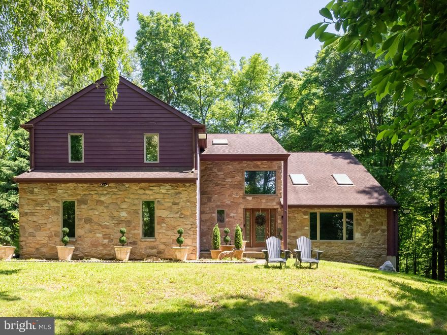 Welcome to 9 N Wertz Lane in Glenmoore, a contemporary colonial style home nestled on a stunning 4.4-acre wooded lot providing ultimate privacy located in the Downingtown School District with the top rated STEM academy and close to all of your everyday needs. Secluded and serene, this property has beautiful views from every window, making you feel like you live in a private oasis where you can unwind and reconnect with nature. Feel right at home as you enter the soaring 2-story foyer that flows seamlessly into the spacious living room with vaulted ceiling and find beautiful hardwood floors and fresh paint. French doors have been added to the adjacent dining room, allowing for the flexibility of utilizing this space as a home office. The eat-in kitchen features Luxury Vinyl Wood Laminate flooring, plenty of cabinet and counter space, stainless steel appliances, and a peninsula offering more room for the home chef. The kitchen opens to the family room, which boasts a cathedral ceiling and stunning focal 2-story fireplace with brand new Luxury Vinyl Wood Laminate flooring. Here you will also find access to the large deck, making entertaining guests seamless. Head upstairs to find the oversized owner's suite, with walk-in closet and full bath featuring a soaking tub, stall shower and dual vanity. Three other bedrooms share an updated hall bath with a tub/shower combo and double sinks. The second floor also offers balcony views to the Living Room and Family Room, adding to the grandeur of this home’s wonderful design. The unfinished basement spans the entire footprint of the home and provides the option to create your dream space! The two-car garage has also been freshly painted and a top of the line insulated  garage door installed, awaiting a garage enthusiast. This well cared property is within a short drive to Marsh Creek State Park, which features trails, watersports, shoreline, fishing, and more! **It is worth noting that PUBLIC SEWER IS COMING (permits and design cleared/state approved)-Upper Uwchlan Public Works has shared that this project is slated to be completed by the end of 2024 and will result in only a quarterly fee of $190 for homeowners.