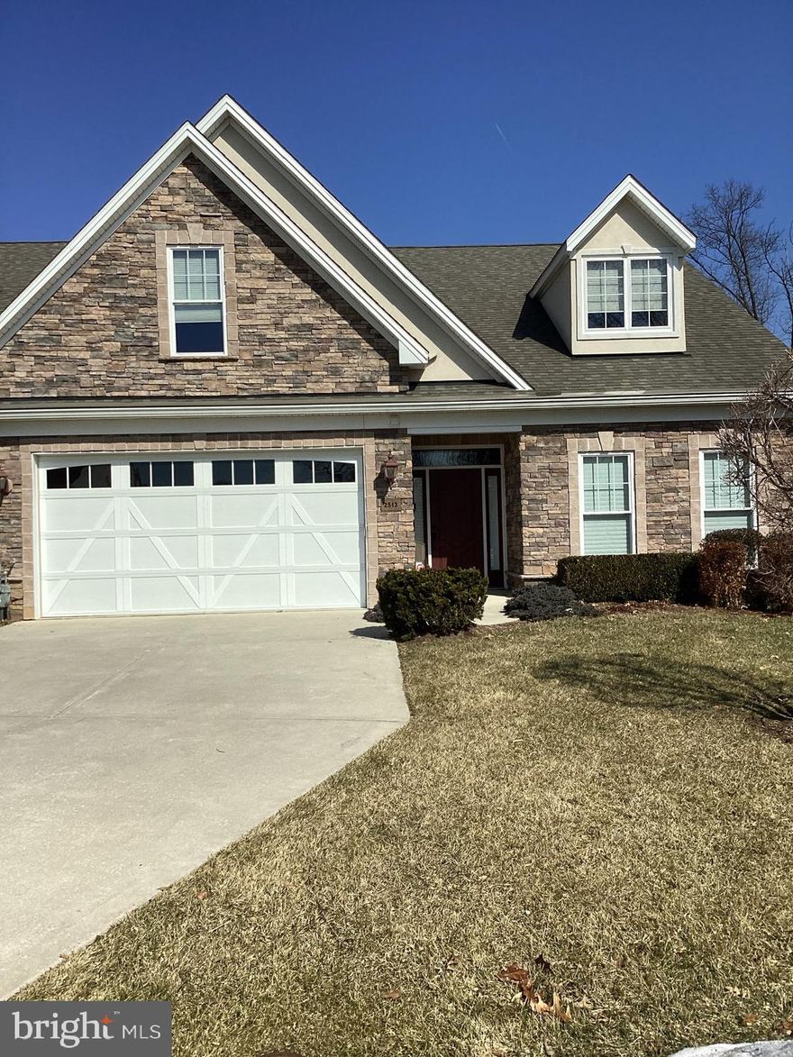 Custom-built, handicapped accessible villa designed for comfort and convenience. Located in a 55+ community. This thoughtfully designed home features low countertops. a full accessible gourmet kitchen with granite countertops and bathroom, including accessible stove, sink, oven and shower. The open floor plan offers spacious living, and the floors offer a warm feeling.  The formal dining room is spacious for entertaining, the cozy breakfast nook overlooks your rear yard. Easy to enjoy the stunning two-sided gas fireplace, luxury vinyl planking and oversized bedrooms throughout.
Additional highlights include the first-floor laundry, an oversized two car garage with lots of storage.  The exterior is stone and vinyl siding with a private patio perfect for relaxing or entertaining. A rare combination of accessibility, functionality and style. Property is "AS IS". 2 Pets Allowed-Larger Breeds have to be approved by condo assoc