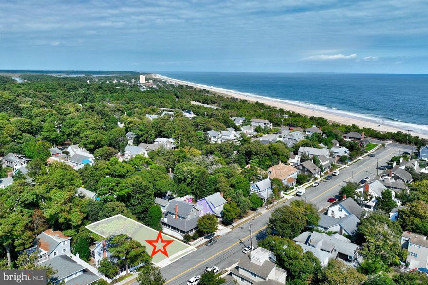 Ocean block opportunity to build your dream home  in the coveted area of Rehoboth Beach known as The Pines. A rare offering, this 50 X 100 lot is located on one of the most picturesque and certainly one of the widest streets in all of Rehoboth. See survey in Documents.  Most homes lining this street have the charm of "Old Rehoboth", each one unique,  beautifully maintained and updated. You'll find inviting front porches; picket fences; cedar shakes; flags flying;  hydrangeas and roses - reminiscent of a time gone by, desirable and welcoming. And perhaps most enticing, its location, steps from the Atlantic. Hear the ocean from every one of the homes on this block.  Presently there is a cottage on the lot, parts of which date to 1933 and has an interior charm  of a home of that era, although has undergone additions and updates in years since. Rarely occupied in recent years, 25 Pennsylvania offers buyers two different opportunities, depending on individual desires. If you are someone who is captivated by cottage charm , with smaller, defined living spaces; bead-board ceilings; built in bookcases; a wood burning fireplace for chilly nights, you may want to keep this home just as it is, sprucing up the exterior that needs to be refreshed.  The front screened porch is where you will feel the ocean breezes and hear those ocean waves, a sound that never gets old. The spacious rear screened porch is framed by an extraordinary mature magnolia and pine,  as well as other trees, providing shade and privacy. There is a small primary bedroom on the first floor with full bath. Bookcases flank the fireplace in the  front sitting room. Bead-board lines the ceiling.   A large cottage kitchen eating area was added to the home in 1992. Imagine hosting large gatherings of family and friends here, spilling out onto the inviting rear screened porch. Upstairs you'll find 3 additional bedrooms, two small and one very large with sitting area. The upstairs bedrooms share a full bath with tub/shower combination. At the top of the stairs you'll find a real treat as you exit onto a large second story composite deck overlooking the back yard. Eat lunch, read a book, sunbathe or take a nap- it feels as if you're in a tree house. A long driveway allows for ample parking for at least 3 cars. Additionally, there is a large out building for storage of bikes, beach toys and more. Attached is a large outdoor shower. An alternative, at this price, if you are dreaming of a new, modern home this is your chance to make that dream come true. Out with the old and in with the new on this 50' by 100' foot lot,  a rare opportunity in the ocean block.  You decide, but either way, you won't be sorry. Pennsylvania Avenue is the last street beyond the north end of the boardwalk that is lifeguarded in the summer, being adjacent to state park lands.  Enjoy its proximity to the boardwalk, shops, restaurants and all Rehoboth has to offer as well as Gordon's Pond at the Henlopen State Park and the Breakwater Junction Bike Trail, with stunning views over glades leading to Lewes and beyond.  Home is being sold in "AS IS" condition.
