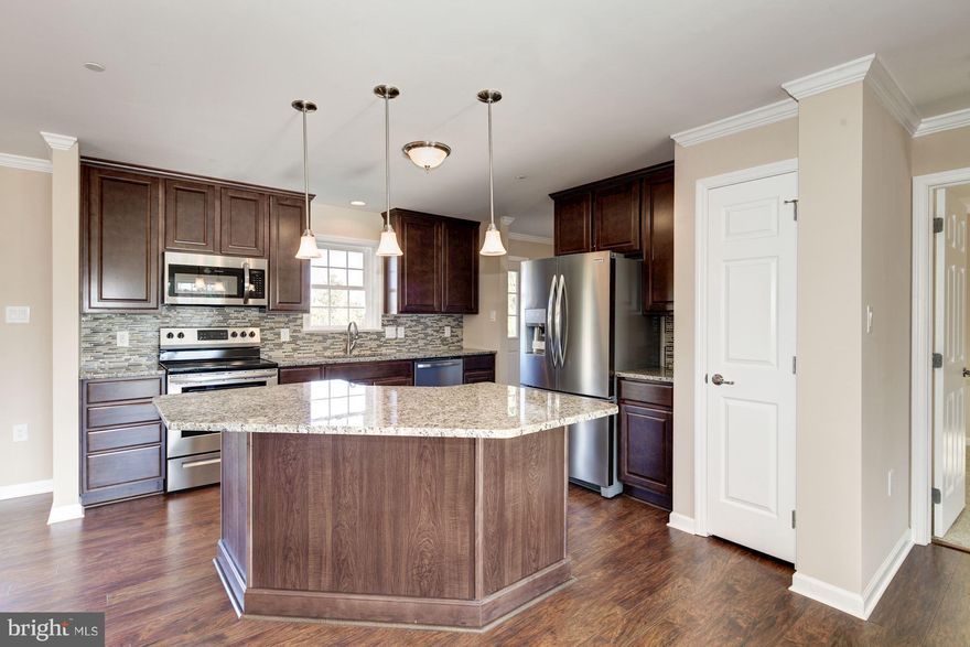 Fantastic Deal ! Ready to Go!!! This is a new 3 bedroom, 2 full bath, open floor plan with custom touches throughout. Features include Granite Counter tops and custom back splash, Custom floors, tile, crown molding in every room, Stainless Steel Appliances, a full basement and paved driveway with lots of parking. Move in before the Holidays!  Owner/Agent..