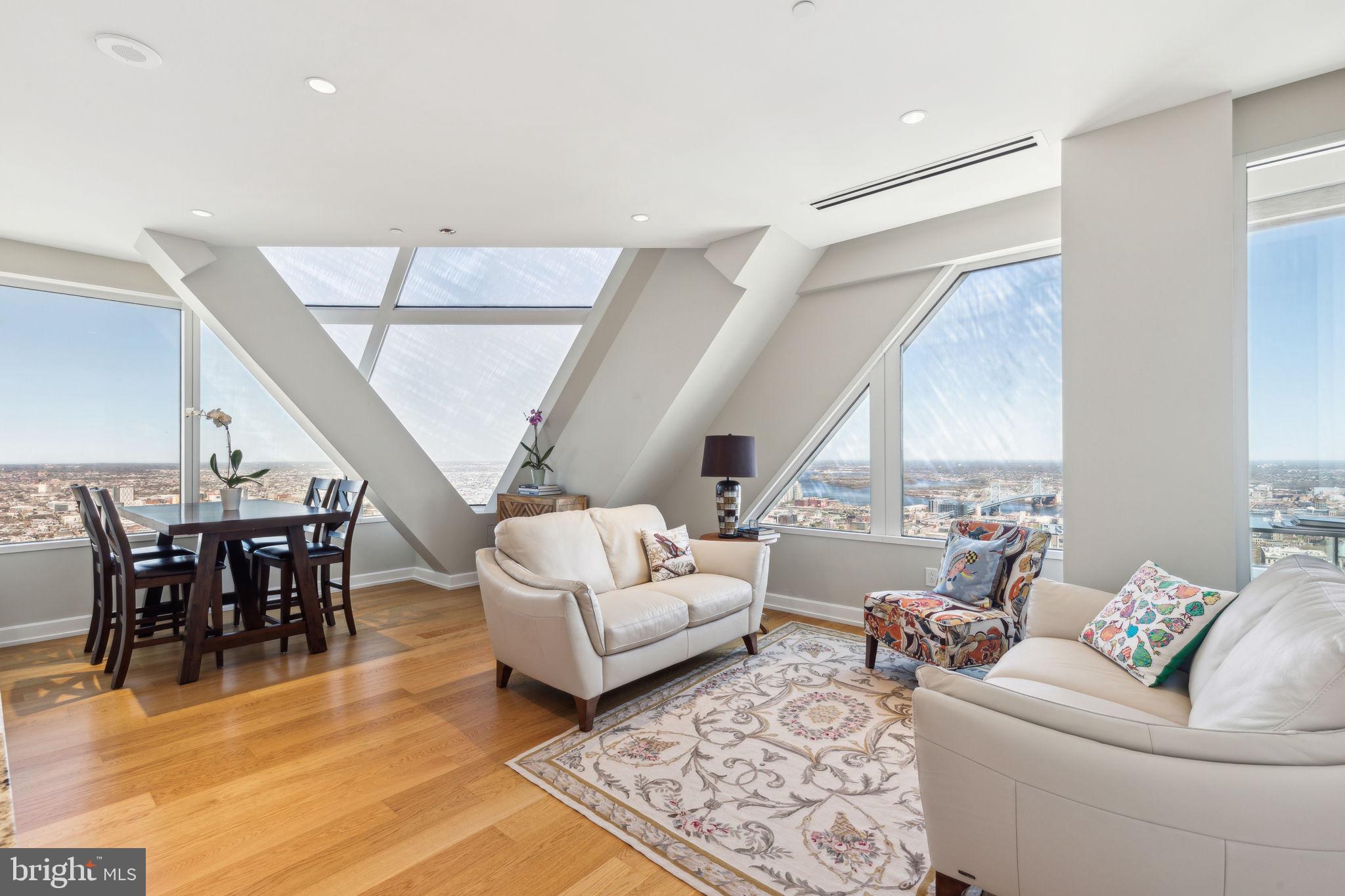 Luxurious sophisticated living in the heart of Center City at The Residences at Two Liberty. This East/North facing 2 bedroom, 2 bath home has unobstructed spectacular views of the Ben Franklin Bridge and City Hall including fabulous architectural window details only available on the higher floors. Two Liberty has top of the line finishes evident from the moment you enter this home. The Chef's Kitchen has white Snaidero cabinetry with Miele cooktop, wall oven, dishwasher, microwave and a Sub-zero refrigerator. The living room/dining area has hardwood floors, recessed lighting and the most spectacular views of Philly. The spacious Main Bedroom has 2 walls of closets and a luxurious bathroom including dual sinks, large walk-in shower plus a separate tub. The 2nd bedroom has a wall of closets. The 2nd luxurious bathroom is located right outside this bedroom. There is a laundry closet with a full size stackable washer/dryer plus additional storage. The private residences at Two Liberty has 24/7 concierge, valet parking available at an additional monthly cost plus a chauffeured car available for your convenience. The new 37th amenity floor has gorgeous designer finishes with an endless pool, fitness center, yoga studio, steam showers, sauna, common area rooms, meeting room, business center plus a fabulous kitchen for your catered events. This condo has luxurious finishes throughout including hardwood floors, recessed lights, wall of windows and much more. Situated near Rittenhouse Square and the Avenue of the Arts offering fabulous dining, theater, opera, nightlife, shopping and transportation. Pet friendly building. Easy to show!!! Tax abatement until 2026.