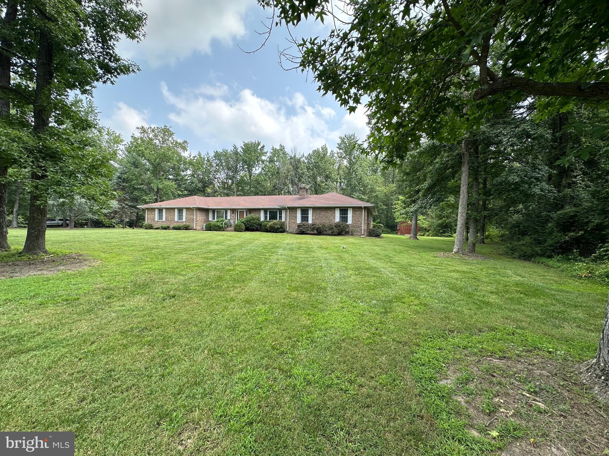 Beautiful Brick Rancher in Great Oak Estates – Chestertown, MD
Nestled on 1.33 acres in the desirable Great Oak Estates community, just a short walk or golf cart drive to Safe Harbor Great Oak Landing marina, restaurant and golf course. This spacious 2,700 sq. ft. brick rancher blends timeless craftsmanship with classic Eastern Shore charm. Built with solid construction, the home features gleaming hardwood floors, elegant crown molding, and rich solid wood accents throughout. The craftsmanship is truly one of a kind. A thoughtful single-level layout offers generous living spaces, perfect for both everyday comfort and entertaining. The home is surrounded by mature trees and open lawn, along with a full screened in porch with direct access to the backyard. This property provides the perfect balance of privacy and neighborhood appeal—all just minutes from water access to Fairlee Creek and the Chesapeake Bay.