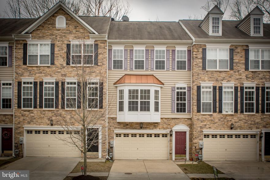 Stunning, above ground 3 level luxury townhouse located in the heart of Ellicott City *Stone front with 2 car garage *High 9 feet ceilings on ground level and main living level *New Wood flooring throughout main level* New Carpet *Freshly Painted *Maintenance free deck *spacious KIT w/SS appliances, corian counters, *Separate morning room off of Breakfast room*Easy access to Route 29, I-695 and I-70.