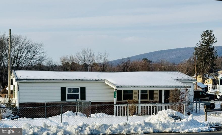 Newly renovated 2 bedroom Rancher with covered front porch, fenced in front yard,  new laminate floors throughout the house,  new kitchen cabinets and counter with new microwave and dishwasher.  Updated bathroom.  Recessed lighting and freshly painted walls.  Additional features include central AC, large shed in the rear yard and big mudroom / laundry room with lots of built in cabinets with sink and counter space.