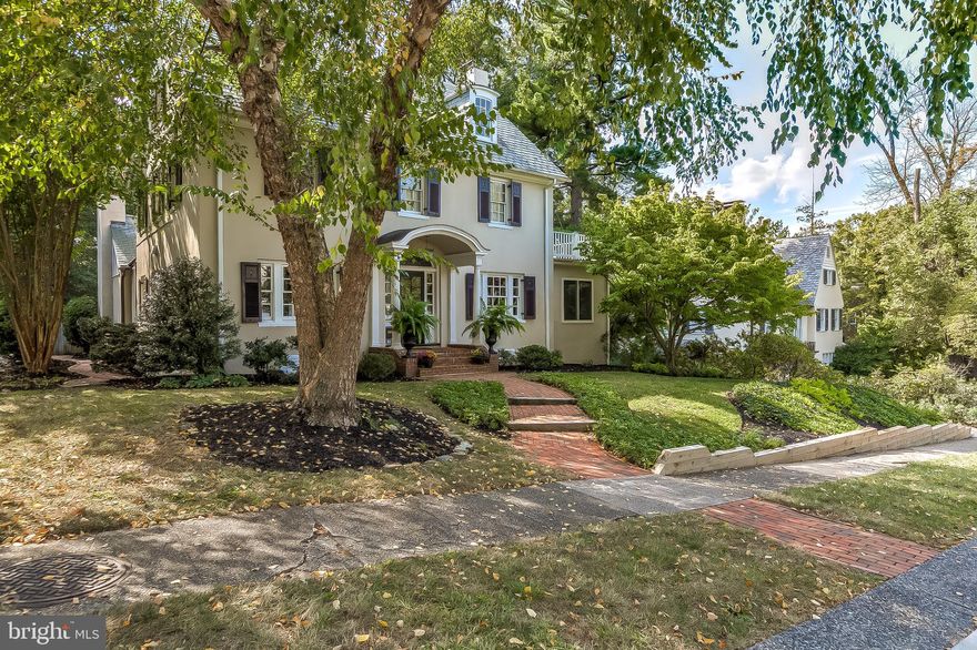 Located on a premier street in Guilford on the coveted Roland Park side, this impressive 5 bedroom, 3 full/ 1 half baths residence exudes an incredible sense of sophistication, design, style, and attention to detail.  The home is ideal for entertaining or casual family comfort.  This classic stucco center hall colonial is appointed with beautiful moldings, wainscoting, millwork, distressed pine and hardwood flooring.  Each room is exceptional and appealing.  On the main level the home features an inviting foyer with beautiful wainscoting, a stylish living room with wood burning fireplace, charming formal dining room with corner cabinets, sun-drenched sunroom with walls of windows, updated cook s kitchen with wood cabinets, quartz countertops, and stainless steel appliances.  Adjoining the kitchen is  a dramatic vaulted family room addition with gas burning fireplace, distressed pine flooring, with access to an expansive deck overlooking the lovely rear lot.  A powder room   and side entry mud room complete the main level.  The second level includes an en-suite master bedroom and bath with French doors to balcony access, built in cabinets and closets, and a terrific bath with large walk-in shower and linen closet.  There are two additional charming bedrooms on this level and an updated bath with tub/shower.  The third level features two additional bedrooms and a full bath.  The lower level houses the laundry area, has exterior side access, and is perfect for storage. The one car garage is located on the lower level and is accessed from a gated driveway and parking pad on the side and rear of the property.  Lush gardens, hardscape, and gorgeous plantings further enhance the refinement of this splendid residence. The property is desirably located within walking distance to some of the most prestigious public and private schools, great caf s, and restaurants.  Hospitals, institutions, shopping and major highways are nearby. A home warranty is provided.  BROKER S OPEN   9/25 from 12   2 PM.