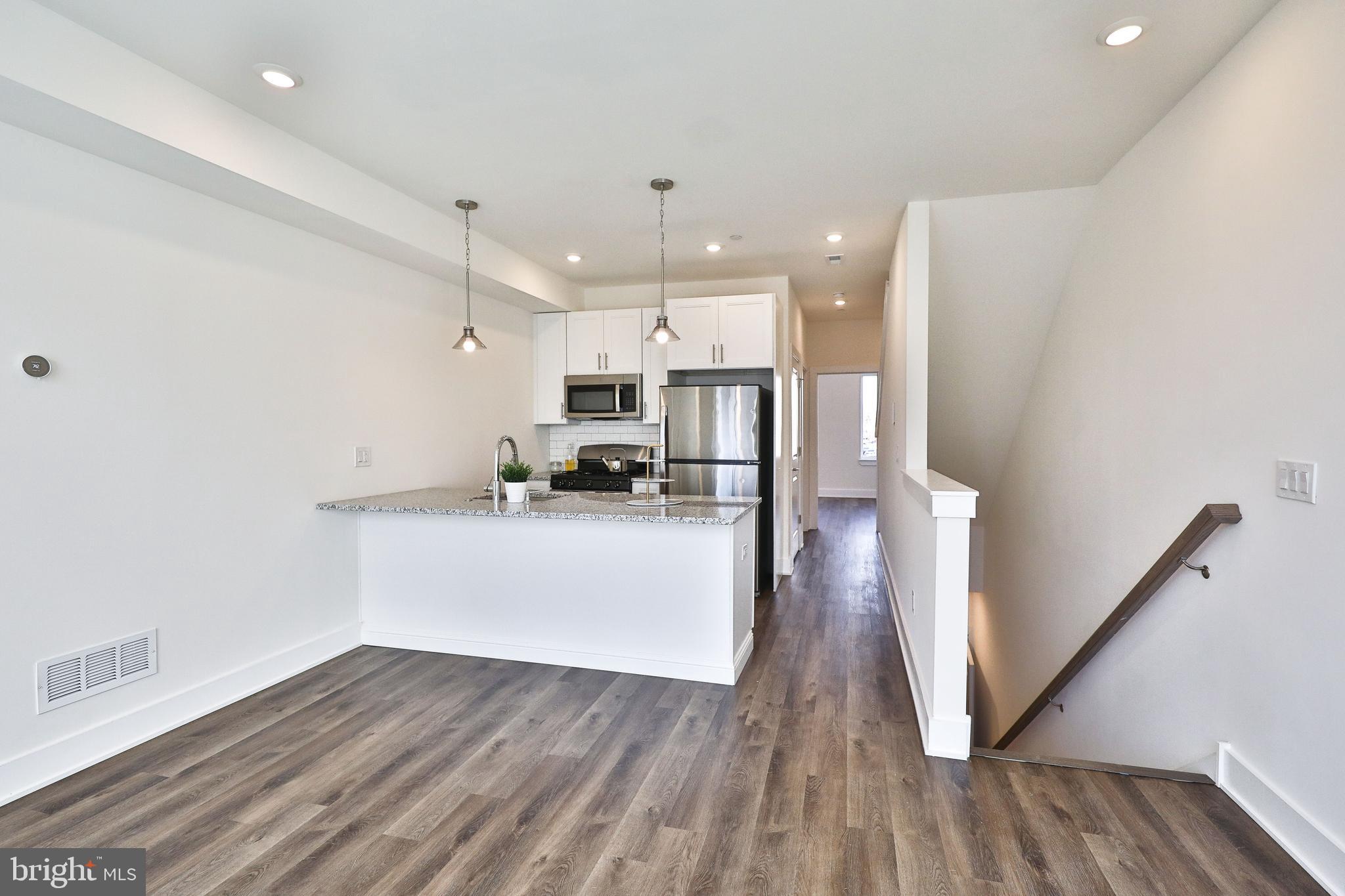 Enter this lovely Dickenson Square apartment into the living room which is bright and airy. The kitchen features soft-close cabinets, stainless steel appliances, gas stove, dishwasher, garbage disposal, washer and dryer and a breakfast bar that seats 3. On this floor you will find the large first bedroom, with an en-suite bath which also opens to the hall for convenient guest access. Upstairs are 2 equally sized bedrooms that both feature their own bathrooms with extra large standing shower in the primary. Head to your large private rooftop for some amazing outdoor space to enjoy your summer gatherings.
The location can't be beat, a quiet and safe part of the neighborhood of Pennsport which is right next to the Dickinson Square Park! Close access to Target, Acme, plus all the local restaurants and coffee shops.
12 Month Term. Tenant pays for Gas and Electric. Water is a $50 flat fee.