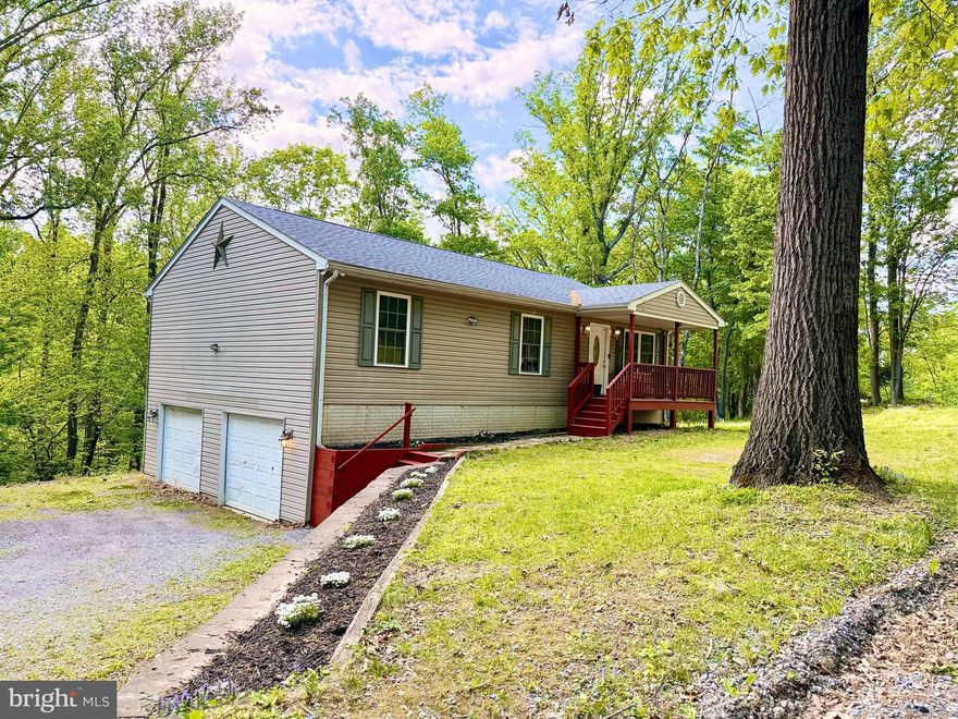 Welcome home! This well-maintained property, built in 2008, offers 3 bedrooms and 2 full bathrooms, along with a mostly finished basement and a large oversized 2-car attached garage. Enjoy the peace and quiet from your wonderful back deck or relax on the front porch—both recently stained and ready for the new owners. The home has been freshly painted and features beautiful LVP flooring throughout. Major updates include a refrigerator just 2–3 years old, stove and dishwasher approximately 5 years old, a water heater only 1.5 years old, and a well pump replaced 3 years ago—showcasing how well this home has been cared for. Conveniently located just 2 miles from Shannondale Lake and Mountain Lake Club, where you can enjoy a sandy beach and spend time with friends and family. This home truly offers comfort, updates, and a peaceful setting—ready for its next owners!