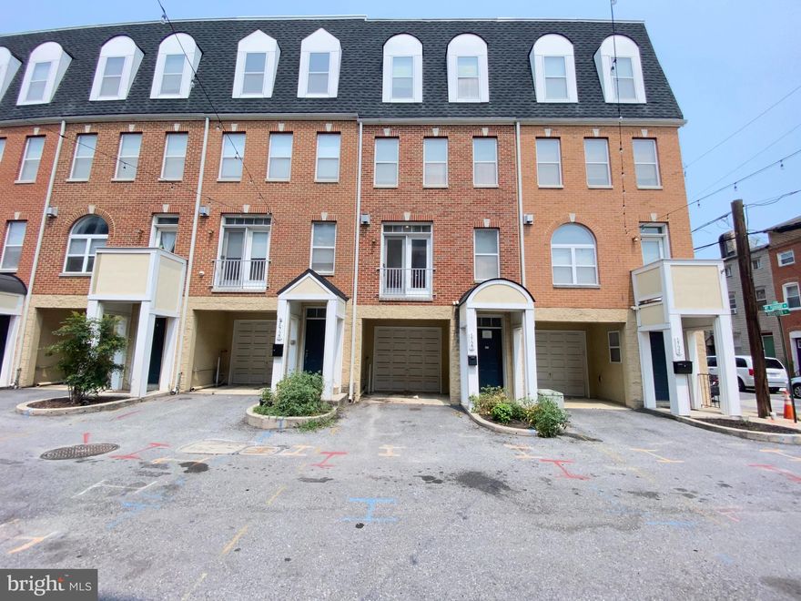 Wonderful chance to own this 4-story brick townhouse in the community of Fells Point. This townhome features three spacious bedrooms, two full bathrooms, and one half bath, including a huge primary bedroom with walk-in closet and en-suite bath with dual vanity, whirlpool tub and separate shower. The gourmet kitchen has center island, 42" maple cabinets, stainless steel appliances and granite countertops. The main level flows from the living room into the kitchen and dining area, complete with hardwood floors and a cozy fireplace. The lower level houses a large garage that provide space for 2-cars and the utility room.  You can relax and have fun with your friends on the wide roof top with beautiful panoramic view of the city. Home is conveniently close to Inner Harbor, Paterson Park and Downtown Baltimore.