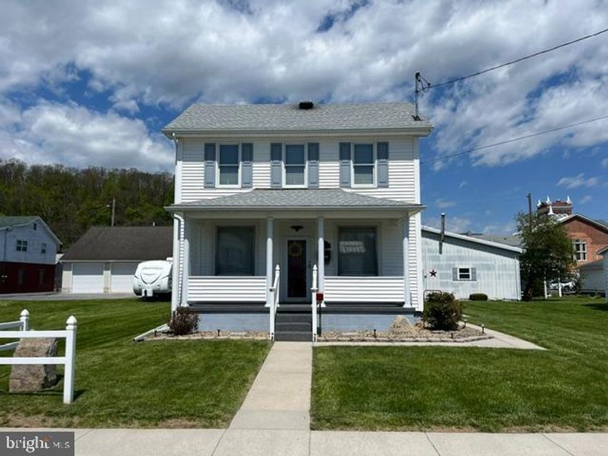 Don't miss this charming 2-story, 3-bedroom home on South Street in Everett. The main floor features an eat-in kitchen (with stove and refrigerator included), living room, den and half bath. Upstairs you'll find 2 nicely sized bedrooms, an additional smaller bedroom, and a full bathroom. Outside you will find very nice covered front and side porches, plus a rear covered patio to enjoy in the summer evenings. The large level lot features a well-maintained lawn, tasteful landscaping, and an electronic dog fence. At the rear of the lot is a 40ft by 48ft garage, with 3 overhead doors: 12ft, 10ft and 8ft, plus an office space. This home is a real gem and absolutely move-in ready and is ready for its next owner to enjoy.