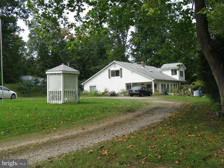 Gorgeous 8.85 acres bordered by stream and a small waterfall. Great for horses. House has open kit. and LR. Large full bath on main level with bedroom, den and family room with stone wall. Upstairs is all master suite with full bath.  Only a little work needed to make this property perfect for nature lovers. But sold "as is" Enjoy the peace and quiet! Approved price.