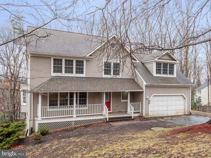 Beautifully maintained home in Aquia Harbour on a large lot is the home you have been waiting for. This home features over 3500 square feet on three levels, 4 bedrooms and 2.5 bathrooms. Moment you drive up to this home you will be captured by its charm with the picturesque scenery all around and the inviting front porch. Upon walking in you will be greeted by warm hardwood floors and cozy finishes. Main level features an open floor plan with a large kitchen together with an island that opens up to a two story family room with a wood burning fireplace as the center point of the room. On the other side of the kitchen you will find a dining room with a bay window and the formal living room toward the front of the home. You can enjoy relaxing times on your large screened in deck overlooking the fenced in yard. Upper level features 4 large bedrooms and 2 full bathrooms including the huge primary bedroom with renovated en-suite boasting a double sink, soaker tub and separate shower. Unfinished basement is a blank canvas that can become anything you imagine and it does have a rough in for an additional bathroom. Once you come, you will not want to leave!  View Tour https://vimeo.com/518325279