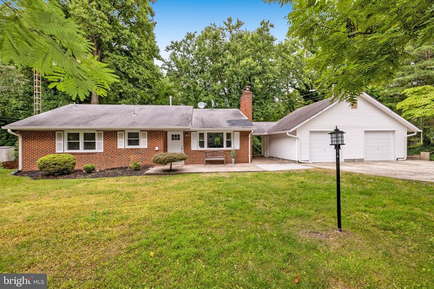 Welcome to 5508 Brookland Road, a fully remodeled 2-story rambler with a detached 2-car garage backing to trees in Alexandria’s desirable Brookland Estates. The front patio gives a cheerful first impression. Sited on a flat over 1/3 acre lot, this 4-bedroom and 3 full-bath residence has all the right touches. New windows have been installed. The kitchen has been thoroughly reimagined with modern white cabinetry, granite counters, center island with pendant lighting, stainless appliances and an oversized deep farmhouse sink. Just off the kitchen is the expansive living room with its classic fireplace. All three baths have been stylishly renovated. There’s a washer/dryer on both levels for your convenience. The huge lower level is light and bright with all the light streaming through the many windows. It offers lots of options and walks out to the private back yard with the lush canopy of trees. The garage has two windows, a side door and room for lots more than just 2 cars. This fine property is located close to shopping, all commuter routes and a quick hop to Old Town.