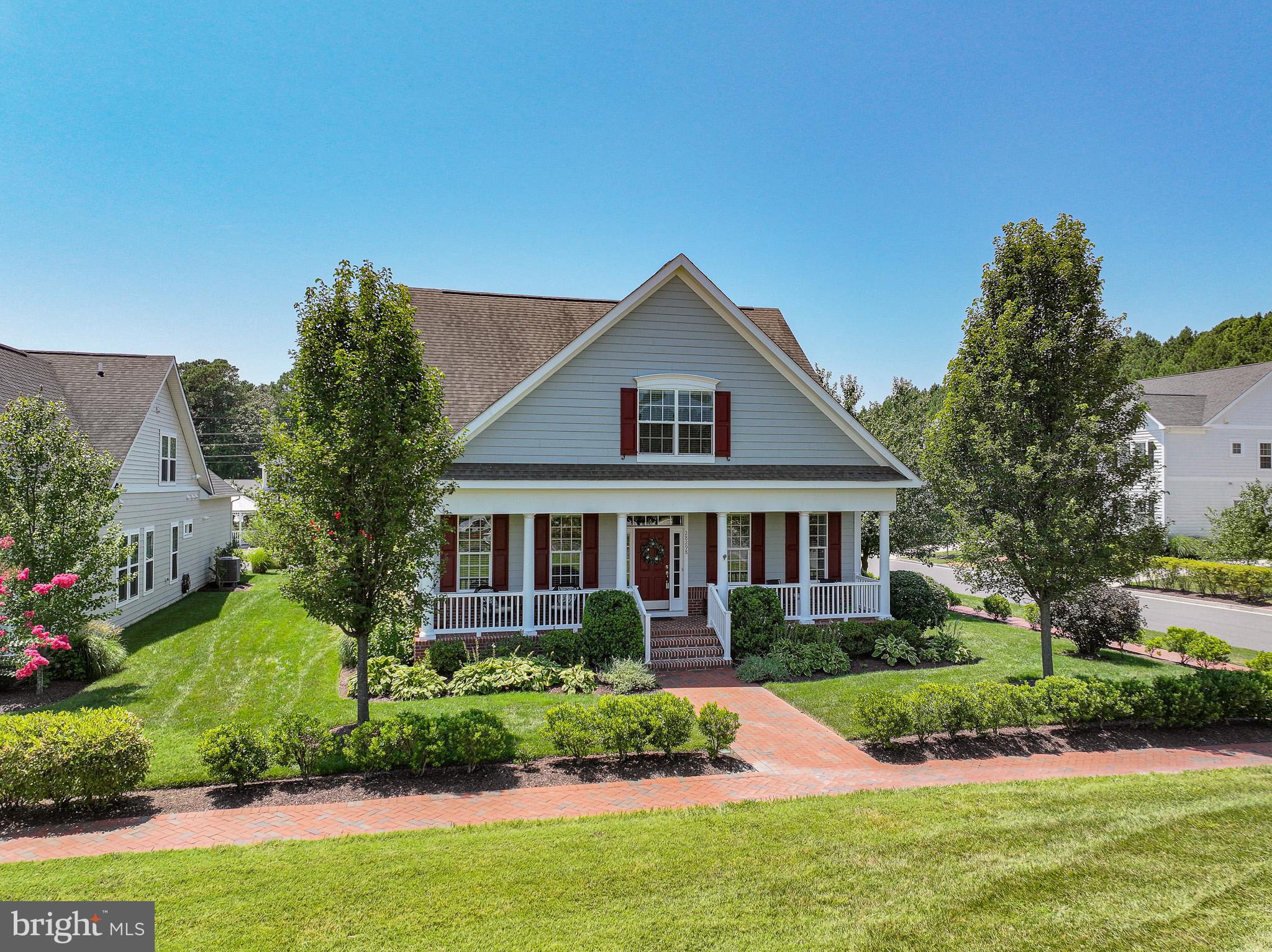 Welcome to Easton Village—one of the Eastern Shore’s most desirable waterfront communities. Residents enjoy access to the Tred Avon River, community pier, clubhouse, outdoor pool, bocce court, kayak launch, 3+ miles of walking trails, 50+ acres of open space, and a pedestrian bridge connecting directly to downtown Easton. Conveniently located just minutes from Easton’s shops, restaurants, and healthcare, and a short drive to St. Michaels and Oxford.
This owner designed 3-bedroom, 3-bath home is ideally sited on a premier corner lot, adjacent to dedicated open space on a quiet, low-traffic street. A wide front porch and side screened porch provide comfortable outdoor living, while the fully fenced backyard with mature landscaping offers added privacy.
The main level features hardwood floors throughout the entry, living and dining areas, kitchen, and family room. Crown molding and custom window treatments add warmth and detail. The open-concept living and dining space includes a bay window, while the kitchen offers granite countertops, an island, stainless steel appliances, and abundant cabinetry—open to a spacious family room with a gas fireplace.
The first-floor primary suite includes a large bath and walk-in closet. A second main-level bedroom is currently used as an office and includes custom shelving. Upstairs, a flexible loft space is ideal for a den or playroom and is flanked by two additional bedrooms, a full bath, and a large walk-in storage room.
Additional highlights include an attached two-car garage, rear alley access, and beautifully landscaped, fenced yard. A rare opportunity in one of Easton’s most amenity-rich neighborhoods.