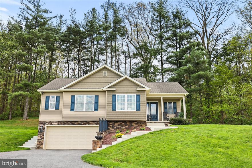 Stunning and meticulously maintained 13‑year‑old rancher on a picturesque 1.2‑acre lot with a wooded rear yard overlooking scenic Carroll County farmland. This beautiful home offers over 1,900 square feet of living space with hardwood floors throughout and an open‑concept design perfect for both everyday living and entertaining. The spacious kitchen features painted cabinetry, granite countertops, stainless steel appliances, and garden doors that are open to a private patio—ideal for enjoying the peaceful surroundings. The main level includes three generously sized bedrooms, two full baths, and a convenient first‑floor laundry room. The finished lower level boasts a welcoming family room with walk‑out access to ground level, offering additional flexible living space. Truly a stunning home that has been lovingly cared for and shows beautifully.