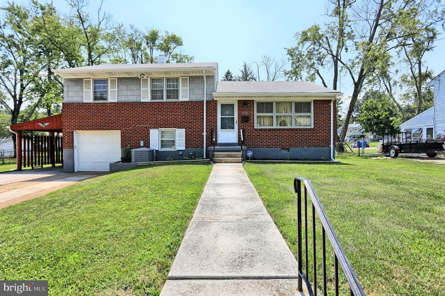Beautifully maintained split level that is a real charmer!  3 bedroom 1.5 bath with a rear sun porch and spacious fenced backyard.  Garage plus a carport and a niced sized driveway provides plenty of parking. 
 As you enter you will immediately notice the attractive hardwoods and gorgeous updated kitchen.  The kitchen area has an eat-in bar, granite countertops, 2 years young appliances and new flooring.  Along with the living room and kitchen, a substantial sized dining room completes the main level.  Head up the stairs to three ample bedrooms along with a full bath.  Down the stairs from the main level is a cozy den, half bath, utility room and entrance to the garage plus the connecting sunroom.  Don't miss out - make your appointment to tour this home soon!!