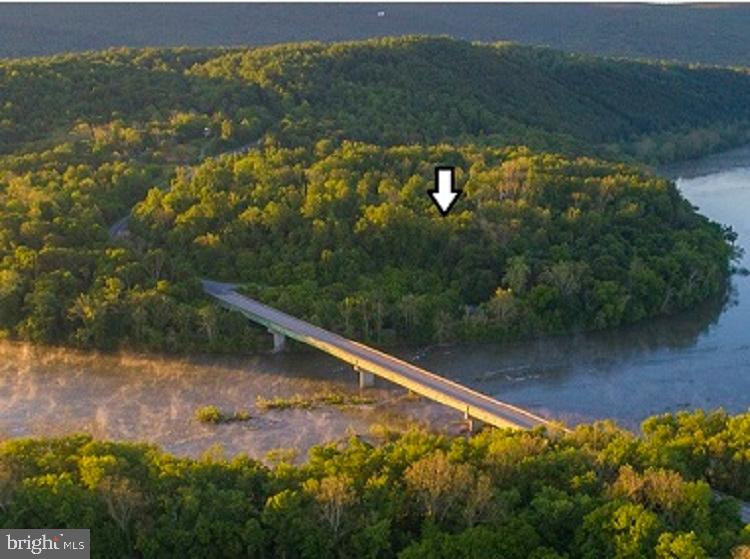Beautiful 11.65-acre riverfront lot with wooded privacy and spectacular views on the Shenandoah River. A rare find! Near the C&O Canal, Appalachian Trail, MARC commuter/Amtrak stations, Harpers Ferry, Charles Town, Shepherdstown, Martinsburg, and Frederick. Washington, DC, Baltimore, and 3 major airports are approx. 90 minutes away. However, Dulles International Airport is only about a 43-minute drive. You could design and build your dream home, enjoy the outdoors, create gardens, raise animals, and much more. The seller did obtain a passing perc test and received an onsite sewage disposal system permit. According to the Jefferson County Planning Department, this lot does have the right to subdivide and develop following the requirements of the land development ordinances.