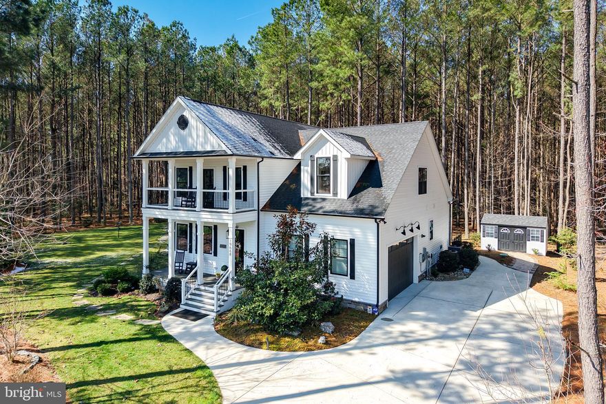 EXPERIENCE A LUX LIFESTYLE NEAR THE BEACH – this entertainer’s dream home has it all; with a private pool, open floor plan, and expansive wooded homesite backing to 20+ acres of community open space and ponds - offering both privacy and room to grow. Designed for modern living and effortless entertaining, this spacious home features soaring ceilings, rich bamboo wood floors throughout (no carpet), custom trim, and abundant natural light. The gourmet kitchen is the heart of the home with a large center quartz island, granite countertops, stainless steel appliances, and a custom on-site built hood vent, all flowing seamlessly into the dining and family rooms; the oversized rear deck creates the perfect indoor-outdoor living experience for gatherings, cookouts, and relaxing evenings. Step outside to your resort-style backyard retreat complete with a private in-ground heater salt water pool, professionally landscaped yard, koi pond, large fire pit area, a spacious double front porch, and partially fenced-in yard—all enhanced by over $80K in owned solar panels for energy efficiency and long-term savings. And, don't forget about the outdoor storage shed for additional convenience and storage (too). The flexibility of this home's layout offers space for every lifestyle, including a first-floor primary bedroom suite, an additional main-level bedroom/office/flex space, and a luxurious second-floor owner’s suite featuring a walk-in closet, soaking tub, and separate shower. Upstairs also includes a huge bonus room, perfect for a media room, playroom, gym, or guest space. The exceptionally large lot offers plenty of room to expand - or to enjoy the outdoors. Additional features include a pre-wired Smart Home system, modern finishes throughout, and thoughtful design for comfortable everyday living. Located just minutes from area beaches, restaurants, shopping, and local attractions, this home combines privacy, luxury, energy efficiency, and convenience - making it a rare opportunity in today’s market. Schedule your private showing today, and experience everything this exceptional home has to offer.