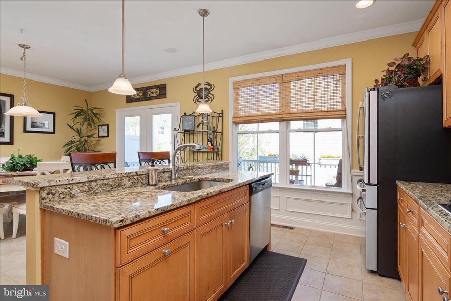 Meticulously maintained by the original owners, this beautifully UPGRADED End-unit Townhome offers 3 finished levels totaling 2300sqft, a 2-car garage, and Rarely found DUAL Primary Suites—each featuring a spa-inspired bath with soaking tub, separate shower, ceramic tile floors & surrounds, and expansive walk-in closets. The entry level features hardwood floors, a spacious living room, private office/flex space, and powder room. Venture up the Oak hardwood staircase to the Open-concept main level, showcasing gleaming hardwood floors in the Great room with corner fireplace that flows seamlessly into the Gourmet kitchen. Highlights include: 42” maple glazed cabinets with soft-close doors and drawers, under and over cabinet lighting, Granite countertops, Stainless steel appliances, Double wall ovens, Gas cooktop, 12x12 Ceramic Tile floors, Lighted pantry, Upgraded Trim package, plus a two-tier island with seating and a separate dining area. Step outside to the 12x20 Trex deck complete w/ propane line for your Grill & outdoor speakers making it perfect for entertaining on these upcoming Summer nights! The upper level features dual primary suites, including a front bedroom with vaulted ceiling and exceptional space throughout & Full size Laundry room w/ Front loading washer/dryer. Additional features include: Brand NEW Roof, central vacuum, whole-house audio throughout main living areas, bedrooms & deck, whole-house humidifier, ceiling fans, brushed nickel fixtures, utility sink rough-ins (laundry and garage), custom garage shelving, and kayak storage under the deck. Thoughtfully landscaped perennial gardens provide color year after year and is just another example of the love that was poured into designing this home! Enjoy an amenity-rich community with pool, clubhouse, and floating dock/pier with access to Thompson Creek. Ideally located just minutes to the Chesapeake Bay Bridge for an easy commute and convenient access on and off the Shore. Don’t forget to Check out the 3D iGuide Tour!