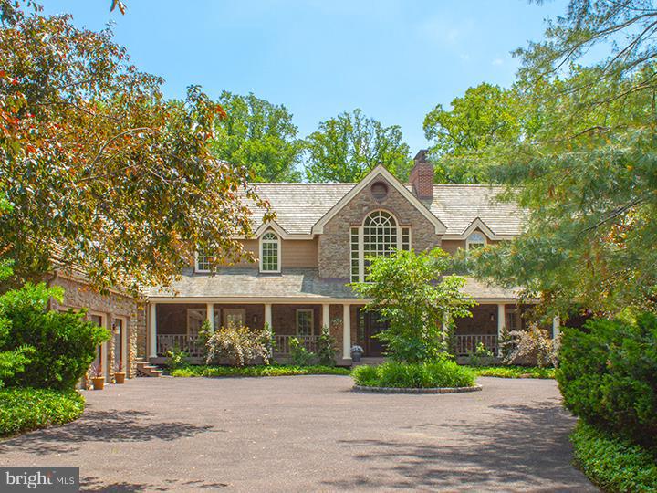 This magnificent, 4 Bedroom, 4 Full Bath, 2 Half Bath, 6259 sq ft Stone and Cedar Craftsman-style home sits on a beautifully maintained, fenced, level 1.44 manicured acres on one of the most desirable streets in sought-after Penn Valley. Amenities include a grand Entrance Hall with arched window, 4 Decks, 4 wood-burning Fireplaces, high ceilings, recessed lighting, gorgeous wood moldings and beautiful hardwood floors throughout. Oversized Living Room has a wood-burning fireplace and access to a charming, covered front porch. Large formal Dining Room with beautiful crown molding and chair rail also opens to a covered front porch. Renovated chef's Kitchen has an expansive Island and Breakfast Bar. Separate sub-zero refrigerator and freezer, double convection oven, walk-in pantry, prep sink, and subway tile backsplash. Kitchen opens to a sunny and spacious Breakfast Room with skylights, vaulted ceiling, floor to ceiling windows, with access to large deck. Delightful Family Room with a huge stone fireplace, pocket doors and access to kitchen deck and the deck off of the living room. Large private Office/Study with vaulted ceiling, sky lights, Powder Room, custom built-ins and wet bar. Den/Library has French doors out to the covered, tranquil back deck. Mudroom off kitchen leads to a 3 Car-Garage with full storage above. Second floor luxurious Master Suite, complete with high ceilings, 2 walk-in closets, wood-burning fireplace and an indulgent, marble Master Bath with a Jacuzzi, shower, and double sink vanity. Three additional, spacious Bedrooms with gorgeous hardwood floors, private updated Bathrooms and plenty of closet space. Enormous unfinished Lower Level with high ceilings and endless possibilities. New Cedar Roof, new 2-Zone HVAC, 2 new Hot Water Heaters, Solid Wood Doors & Windows, fresh paint inside and out. Convenient to 76 and minutes to Center City.