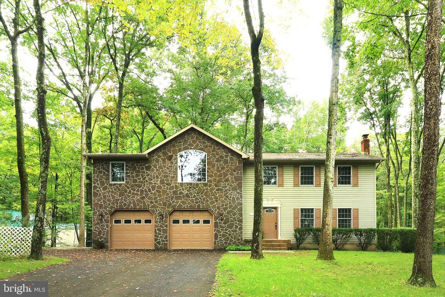 Welcome to your private oasis! Tucked back off the main road is a beautifully renovated home waiting for your stamp of approval. This property features 4 bedrooms with 2.5 bathrooms, an eat-in kitchen, massive owners suite, an oversized garage and more! Wander through the first floor where you'll find a generous sized living room, a half bathroom, and an eat-in kitchen with new flooring that has direct access to the back yard of your dreams! Follow the stairs up to the massive owners suite featuring walk in closets with laundry hookups and a beautiful primary bathroom attached. 3 additional bedrooms and 1 full bathroom complete the upstairs for the ultimate floor plan. In the basement there is one large bonus room with additional laundry space allowing you to decide how you'd like to utilize this space! Added in 2006, the 30x30 oversized heated garage not only has additional storage but it also features both hot and cold water hookups! Outside you'll have 1.8 acres of partially fenced in space to roam and enjoy the large garden, tree house, swing set and a one of a kind patio lined with greenery and flowers to add a splash of color. A highly productive garden fills out the remainder of the backyard. Dont hesitate to stop by and check out this one of a kind property yourself!
