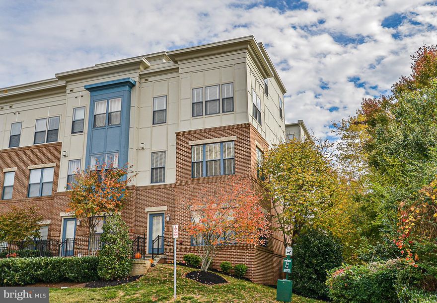 Remarkable! End unit , siding to wooded tree save   Incredible 4th floor, loft with large walk out balcony , incredible vista & outdoor double sided fireplace. Enjoy this open floor plan with 9ft ceilings, gorgeous engineered hardwood on kitchen level   Gourmet Kitchen with center Isle  Stainless steel appliances, cook-top, gorgeous Mocha custom cabinets, Loads of natural light, urban rustic brick veneer  lining the dining area and family room. A Cozy fireplace, plantation shutters  accent the main level. Walk out kitchen to rear balcony! Large master bedroom with generous walk-in closet , custom finish bathroom!   Open Sunday 12/8th 1-4pm.