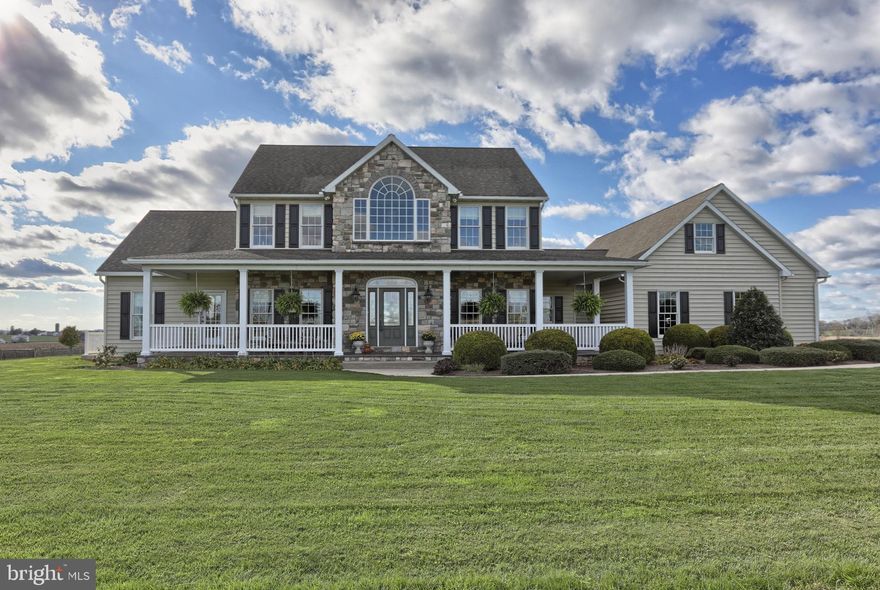 HORSE LOVER'S DREAM PROPERTY!  Don't pass up this rare opportunity to see this unique, very special property offering a beautiful home with loads of special features/upgrades, an 8 acre parcel of land including a growing hay field, pastures/riding ring, and an amazing horse barn - the best of all worlds!  In the home, gleaming ash hardwood flooring flows throughout much of first floor, along with 9 ft ceilings.  An  office, tucked behind beautiful pocket doors off the foyer, provides a quiet work space.  Spacious kitchen boasting loads of beautiful cherry cabinets, granite counters, large island/snack bar, high end stainless steel appliances, and plenty of space for a table to flow into the great room for optimum function.  Natural light splashes into the delightful sun room w/tile flooring, cathedral ceiling and gas fireplace.  First floor MBR suite features two walk-in closets and an updated bath with whirlpool tub, large tile shower & granite top double vanity.  Doing laundry won't be such a chore in this sweet first floor laundry room.  Sun splashed loft area on the second floor adds another nice seating/relaxing space for all.  Energy efficient geothermal heat pump is a huge plus.  Attached, side entry oversized three car garage provides plenty of space for your vehicles.  And then, as you wander out the back, a beautiful 36' x 60' barn beckons.  The custom doors are like a work of art!    Inside, there are four large, matted stalls with heated Nelson waterers, a heated tack room, an office/lounge area with washer & dryer, as well as an elevated pet bath tub, plus a full second floor hay loft.  There are multiple fenced pastures, a run in shed, an attached equipment garage, and an outdoor oversized ring.  Farmland parcels surrounding this property are all in Preserved Farmland status.   So many features too numerous to list await your discovery!  Add this amazing property to your MUST SEE list!!