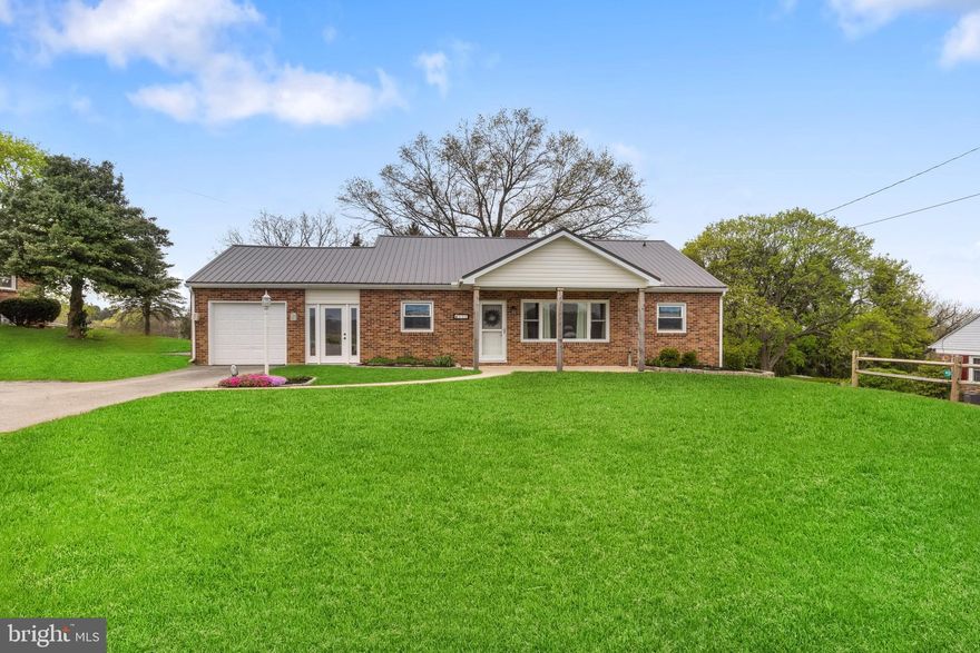 This charming brick rancher offers the perfect blend of comfort, convenience, and countryside charm—all on one level. Nestled in a peaceful setting with picturesque country views from both the front and back, you’ll love coming home to this serene retreat.

Step inside to a cozy living room featuring a classic wood-burning fireplace and a large picture window that fills the space with natural light. The formal dining room is perfect for gathering and the kitchen shines with stainless steel appliances and plenty of cabinet space.

You’ll find three generously sized bedrooms, each with ample closet space, and a beautifully updated full bath on the first floor and lower level. One of the true highlights of this home is the sunroom—surrounded by windows, it’s the perfect place to relax, sip coffee, and take in the peaceful backyard views. Step outside to enjoy a private patio, ideal for grilling or enjoying summer nights.

The full basement provides tons of space and potential. And with a newer metal roof, gutters, front windows, a 1st floor bath remodel, and luxury vinyl plank flooring throughout the main level, this home is move-in ready with so many important updates already done. (These updates were done over the last several years).

There’s also an attached garage for convenient parking and extra storage space.

Whether you're looking for your first home or ready to downsize to easy, one-level living, this home checks all the boxes.

Don’t miss your chance to own this gem—schedule your tour today!