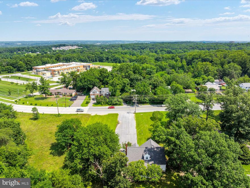 Unlock the Power of Possibility with this Rare, Standalone W1-Zoned Property in the Heart of the Jessup Corridor!  This dynamic, light industrial FLEX building is fully detached and perfectly positioned on a high-visibility, three-quarter acre parcel along the bustling Route 175/Jessup Road corridor. Recently up-zoned to W1, this is a prime opportunity for owner-users, contractors, creative offices, or investors seeking versatility, visibility, and proximity to major government and corporate campuses.  Inside, over 3,300+ square feet of well-maintained, multi-level space is bathed in natural light and brimming with functionality. The upper levels offer seven private, spacious workspaces — including a glass-lined conference room with windows on three sides — as well as a communal kitchen, two full baths (including one adjacent to a private office suite), and a convenient powder room between two offices. Gleaming red oak floors, solid wood doors, business-grade lighting, and upgraded electrical with equipment-ready outlets make it move-in ready for a wide range of industries.  Downstairs, a wide-open, epoxy-floored lower level offers ideal space for light storage, fitness, inventory, or conversion into creative use zones. Separate entrances make it possible to configure for multi-tenant use or to offer client-facing versus back-of-house functionality.  Outside, a beautifully landscaped, fenced courtyard offers a relaxing breakout area for lunches or meetings, and the oversized Amish-built shed (with electric and exterior lighting) adds even more flexible utility. A generous 14-car paved driveway ensures abundant parking for staff or clients.  All major systems — roof, HVAC, windows, and kitchen — have been updated by the long-term owner.  Zoned W1 for light industrial, the land extends to open space in the rear, offering further build-out potential under current zoning guidelines.  Strategically located near I-95, Route 32, 295, 97, and Route 1, with instant access to NSA, Fort Meade, DOD, COPT, BWI, Columbia, and Annapolis — this is a smart investment and a compelling operational headquarters for today's forward-thinking business.  Easy to show. High-quality marketing packet available. Let your vision take shape in one of Central Maryland’s fastest-growing commercial zones!