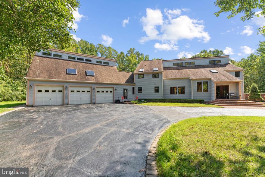 List Price is below appraised value -- walk into this magnificent property with instant equity.  Its a lot of house and the buyer got cold feet - their loss is your gain. Introducing an Exceptional Custom Hillside Retreat on 10.5 Acres with a Meandering Stream, Inviting Swimming Pool, and Unmatched Serenity.

Nestled gracefully against the backdrop of a picturesque hill, this remarkable estate seamlessly blends natural beauty with opulent living. Sprawled across a generous 10.5-acre expanse, it stands as a true sanctuary for those in pursuit of tranquility and luxury. This property boasts an array of well-designed indoor and outdoor spaces crafted for ultimate comfort and enjoyment. Additionally, it features a three-car garage with an additional space above, perfect for potential income generation, an extra office, or a private suite.

With five bedrooms and five full baths, there's abundant space for both family and guests. The residence also includes a convenient powder room, an exercise room, and a cozy library/TV room that opens onto a covered outdoor porch.

The two-story family room, bathed in natural light courtesy of floor-to-ceiling windows, serves as a focal point on the main level. Here, you'll discover a separate dining room, a stately office/library, a welcoming eat-in kitchen, and a mud room/breezeway providing easy access to both the garage and the enticing pool area.

Ascending the upstairs catwalk, you'll find the primary owner's suite discreetly separated from the guest rooms. The primary suite connects to a loft area, two spacious walk-in closets, and a generously appointed bathroom featuring a soaking tub, a standing shower, and double vanities. Two additional guest rooms and another full bathroom complete the upstairs layout.

The lower level mirrors the expansive feel of the upper floors, offering two more bedrooms, each with direct access to the captivating backyard and the pool deck. This level also houses two additional full bathrooms and a versatile flex space, currently utilized as a gym. A second wood-burning fireplace, a recreational room, and a well-appointed wet bar provide an ideal setting for relaxation and entertainment.

Other Features:
Two Fireplaces
Two Wetbars
Workbench
Two laundry areas

**Energy Efficiency and Smart Technology:**
This residence embraces cutting-edge sustainability with three deep-ground geothermal systems, individually serving each floor. These systems not only enhance energy efficiency but also grant you the ability to remotely schedule and adjust temperature controls via the internet, ensuring year-round comfort and convenience. The 2x6 stud frame construction augments insulation, maintaining a consistently pleasant climate within the home.