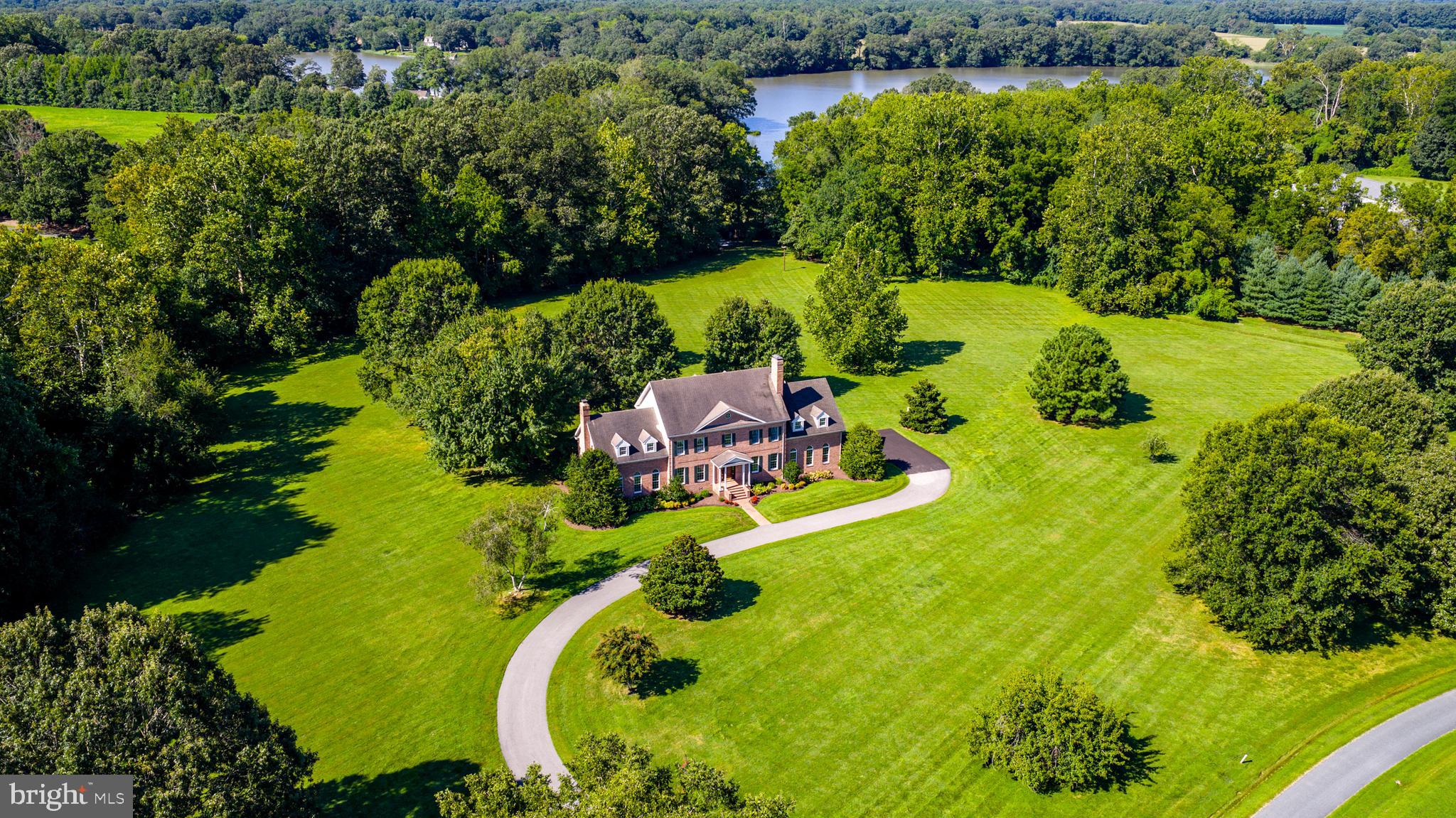 First time offered in 30 years, this stately brick Colonial is set on approximately 7± acres in the desirable Ashby neighborhood. Designed with both comfort and functionality in mind, the home offers 5 bedrooms and 3.5 bathrooms, including an expansive primary suite with two walk-in closets, a private den, dedicated vanity/dressing room, soaking tub, and glass-enclosed shower. An additional bedroom also features its own en-suite, while three more bedrooms provide ample space for family or guests. The heart of the home is the spacious family room, filled with natural light and anchored by a brick fireplace. Two sliding glass doors extend the living space to the back deck, making it perfect for entertaining or enjoying peaceful views. A breakfast area also opens to the deck, while thoughtful details such as built-in bookcases, storage window benches, and abundant closet space reflect the home’s smart design. Additional highlights include a 3-car garage, generous outdoor space, and a large deck ideal for gatherings or everyday living. This home combines timeless Colonial architecture with modern comfort in one of the area’s most sought-after locations.