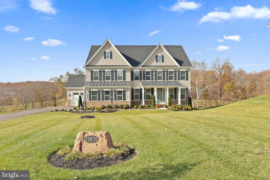 This 2-year young home shows like a model!  Boasting abundant natural light throughout, generously-proportioned living spaces and a fabulous circular floor plan, this pristine home is ready to receive you!  Offering a Main Level Study, Dry Bar, 2-story Family Room w/ coffered ceiling & fireplace that is open to the Eat-In Kitchen w/ Quartz countertops, stainless appliances, large center island & walk-in Pantry plus a convenient Mudroom w/ built-in storage that accesses both garages.  Upstairs, each Bedroom features an EnSuite Bath; the Owners' Suite presents a sprawling, sun-lit space w/ Sitting Room annex & a Primary Bath w/ soaking tub, oversized shower and Dressing Room. The fully finished walk-out Lower Level is perfect and flexible Rec space with a Full Bath.  The piece de resistance is THE VIEW! Overlooking Patuxent River State Park grounds and gorgeous rolling farm pastures beyond, you'll adore viewing each sunset and the grazing horses from the newly-constructed low-maintenance deck. You'll have true peace of mind as well with the whole-house generator!  Are you ready to fall in love with "HOME"?