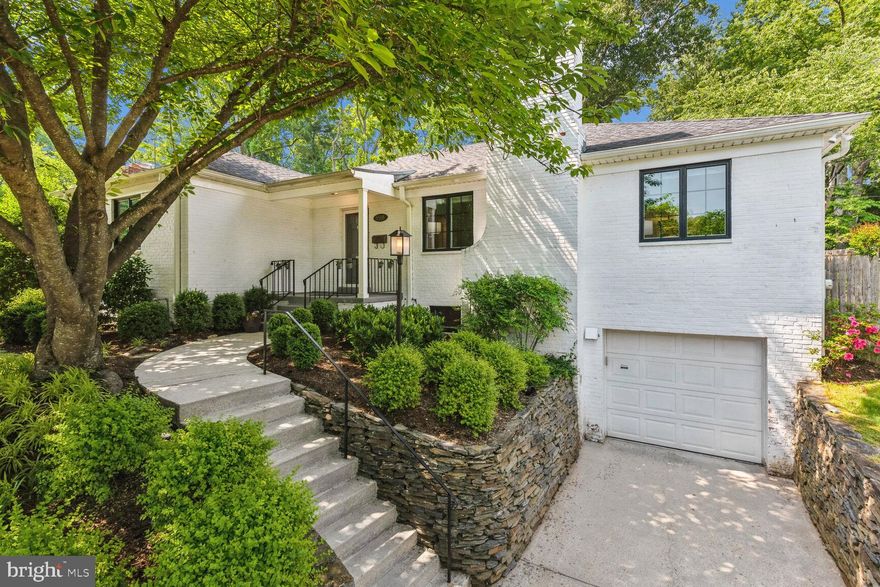 NEW LISTING!! Open Saturday, June 3rd, from 2 - 4 PM and Sunday, June 4th, from 2-4 PM! Welcome to 5508 Namakagan Road, a wonderful home with updates located in the desirable Mass Ave Hills neighborhood.  This five-bedroom, three full bathroom home draws you in from the street with its painted white brick exterior and newer windows throughout, fronted by a refreshing curb appeal, with large, flowering trees and bushes, and well-maintained plantings, covering the hillside.  Step into the wide entry foyer which flows in to a spacious living room with a wood-burning fireplace, and a large open kitchen, dining, and family room area complete with French doors and an abundance of windows allowing light to pour in. Through those French doors, the rear of the house leads to a large and exquisite flagstone patio overlooking the expansive and wonderfully private back yard.  Professionally landscaped, with exterior lighting and beautiful mature trees, this outdoor area is a perfect oasis for relaxation or entertaining. The main floor also includes three bedrooms, including a primary bedroom suite with an updated en-suite full bathroom and excellent closet space.  Two more spacious bedrooms and a second full bathroom complete this level. The main floor layout is ideal for convenient, one-level living. The lower level offers a sizable family room with high ceilings.  There are two additional flexible bedrooms on this level that could also be used as office space, a home gym, or additional living space. Another full bathroom, a separate laundry area, and an attached one-car garage complete the lower level.  The neighborhood offers convenient access to the Capital Crescent, and Little Falls trails, and is minutes to the Potomac River and C & O Canal. The Westbard project, which is under way, will bring new restaurants, shopping, parks, and other amenities all within walking distance. Convenient access to Washington, D.C., major commuter routes, and Reagan and Dulles airports, makes in town and out of town travel a breeze. All of this and located in the Wood Acres, Pyle, Whitman school district. Welcome home!