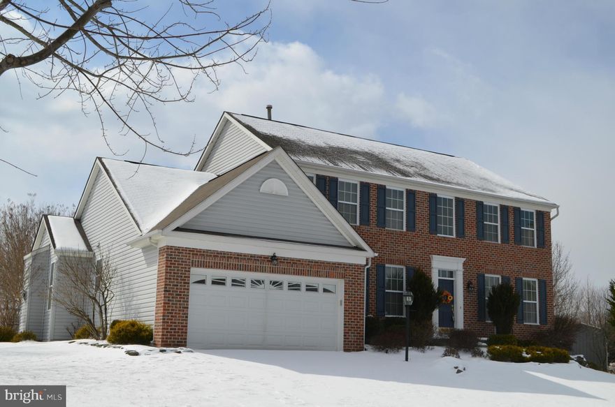 Home makes a BIG statement with over 5000+ finished sq feet & offers best yard in neighborhood backing to wooded open space! Decorator details with custom built ins, trims, moldings & pillars! Huge lower level offers many options w/BR, full BA, wet bar, media & rec rm! Chefs kitchen w/center island & sunrm leads to screened in porch overlooking yard & patio!